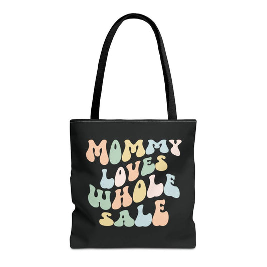 Perfect gift for mom. A black tote bag, available in three sizes. In a typically 70s retro-style font, it says Mommy Loves Wholesale.