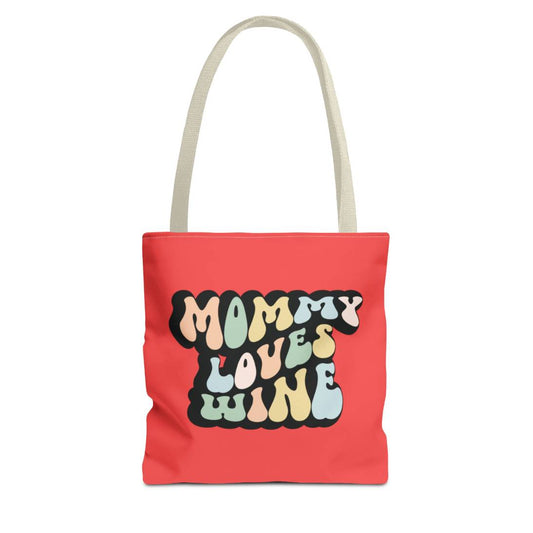Perfect gift for mom. A red tote bag, available in three sizes. In a typically 70s retro-style font, it says Mommy Loves Wine. The handle is beige.