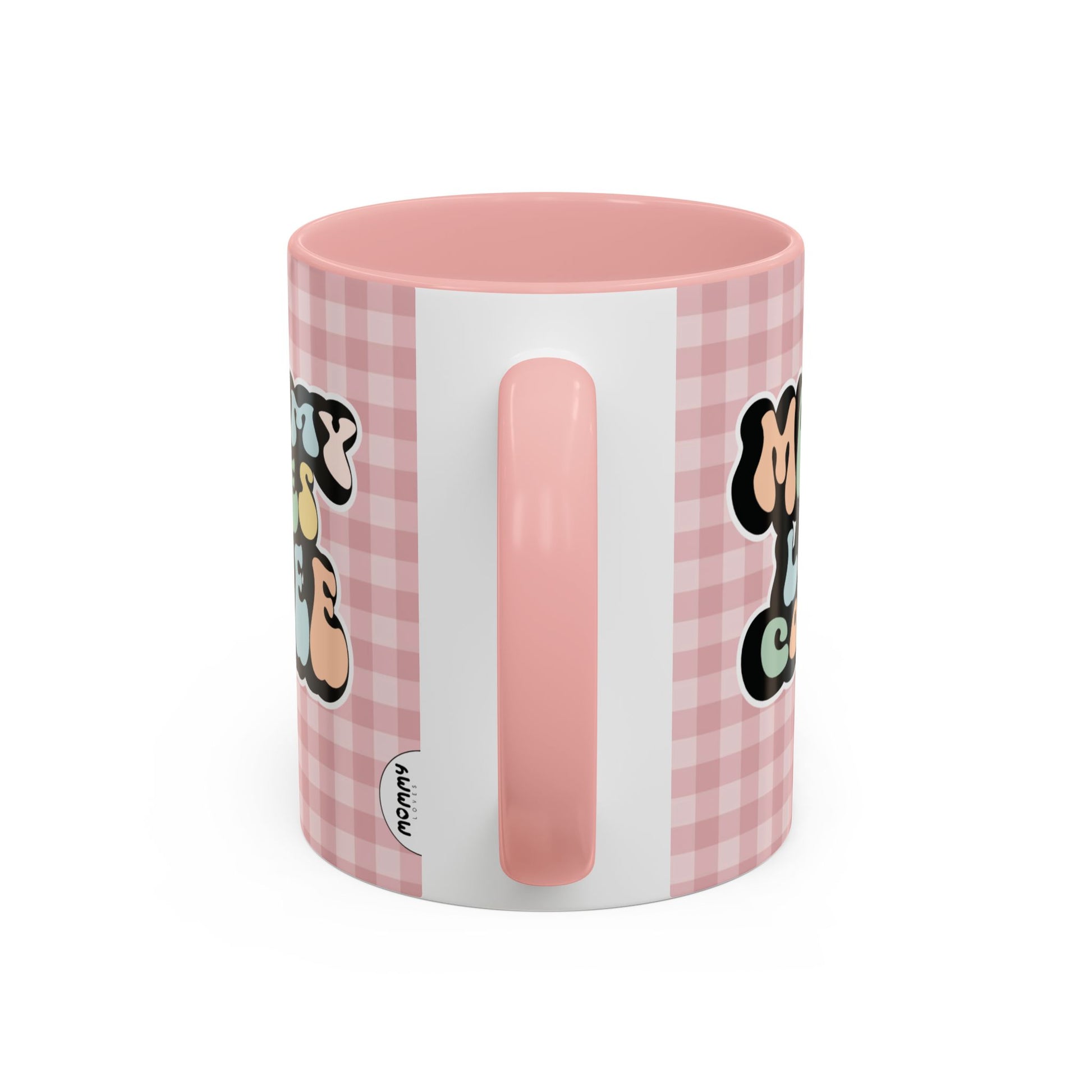 Perfect gift for mom. A decorative, 11oz ceramic mug. It’s wrapped in a soft pink-white checkered background. In a happy and colorful 70s retro-style font it says Mommy Loves Coffee, on both sides.