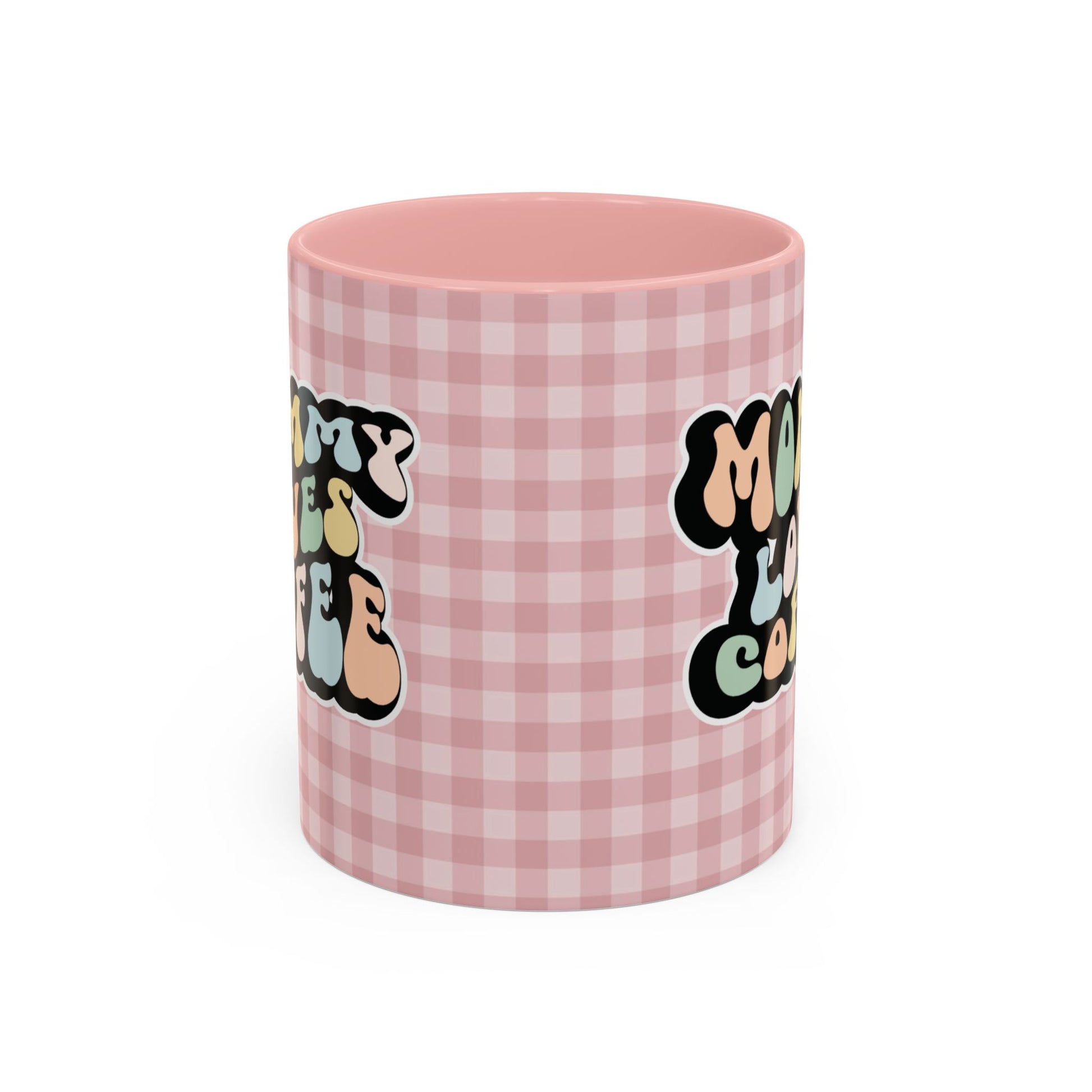 Perfect gift for mom. A decorative, 11oz ceramic mug. It’s wrapped in a soft pink-white checkered background. In a happy and colorful 70s retro-style font it says Mommy Loves Coffee, on both sides.