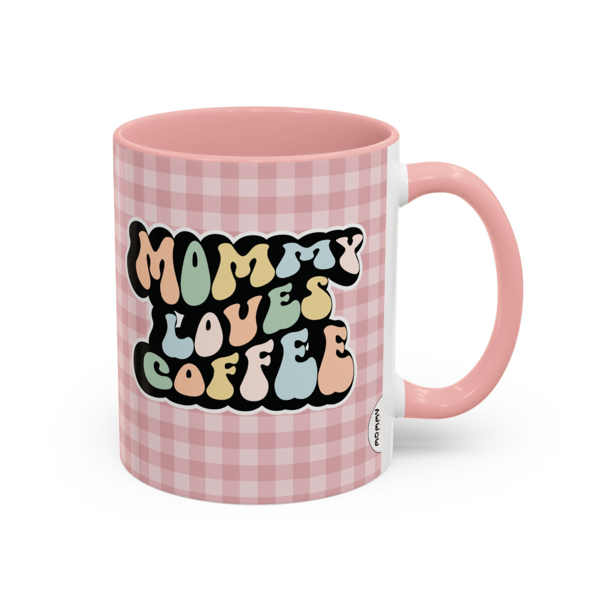 Perfect gift for mom. A decorative, 11oz ceramic mug. It’s wrapped in a soft pink-white checkered background. In a happy and colorful 70s retro-style font it says Mommy Loves Coffee, on both sides.