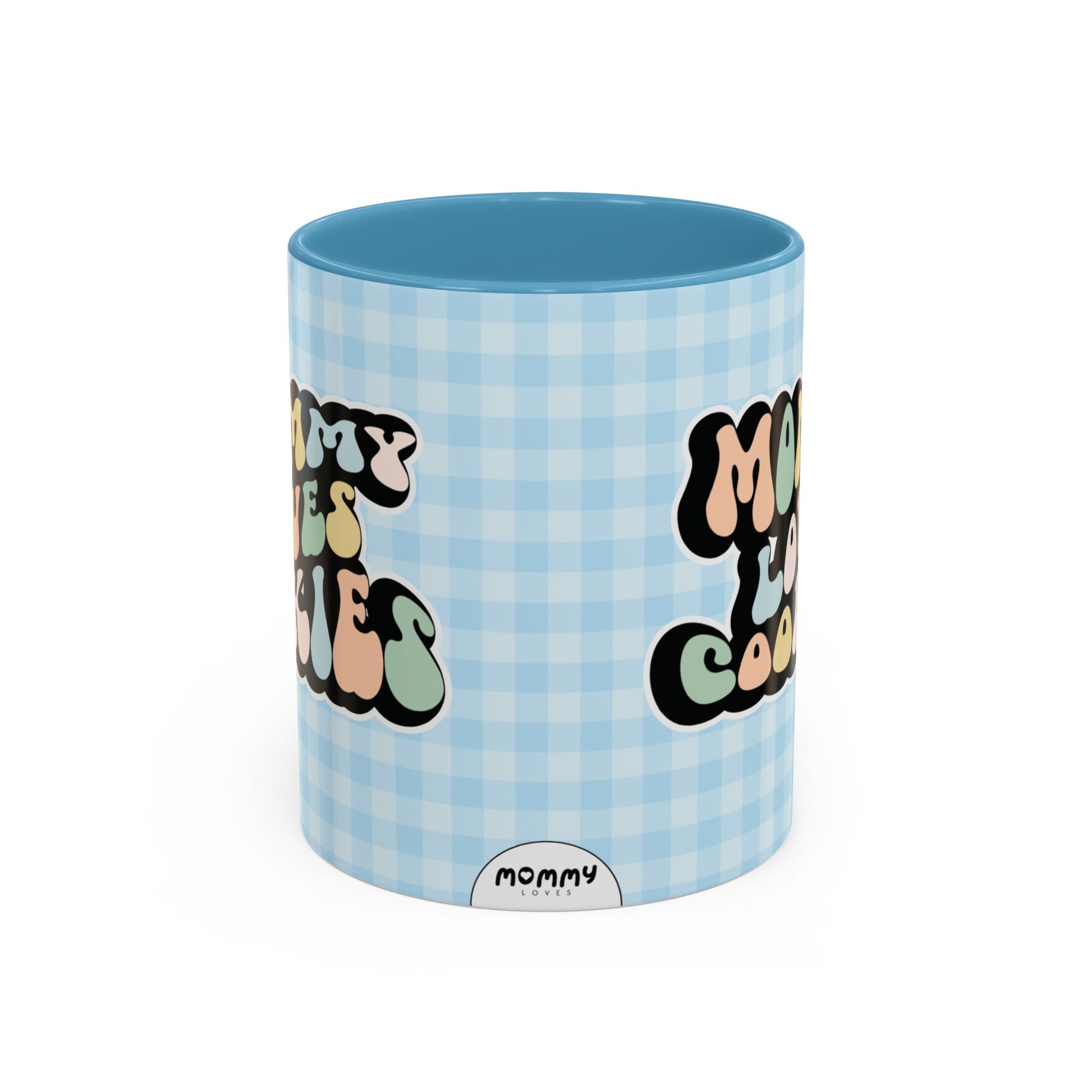 Perfect gift for mom. A decorative, 11oz ceramic mug. It’s wrapped in a light blue-white checkered background. In a happy and colorful 70s retro-style font it says Mommy Loves Cookies, on both sides.