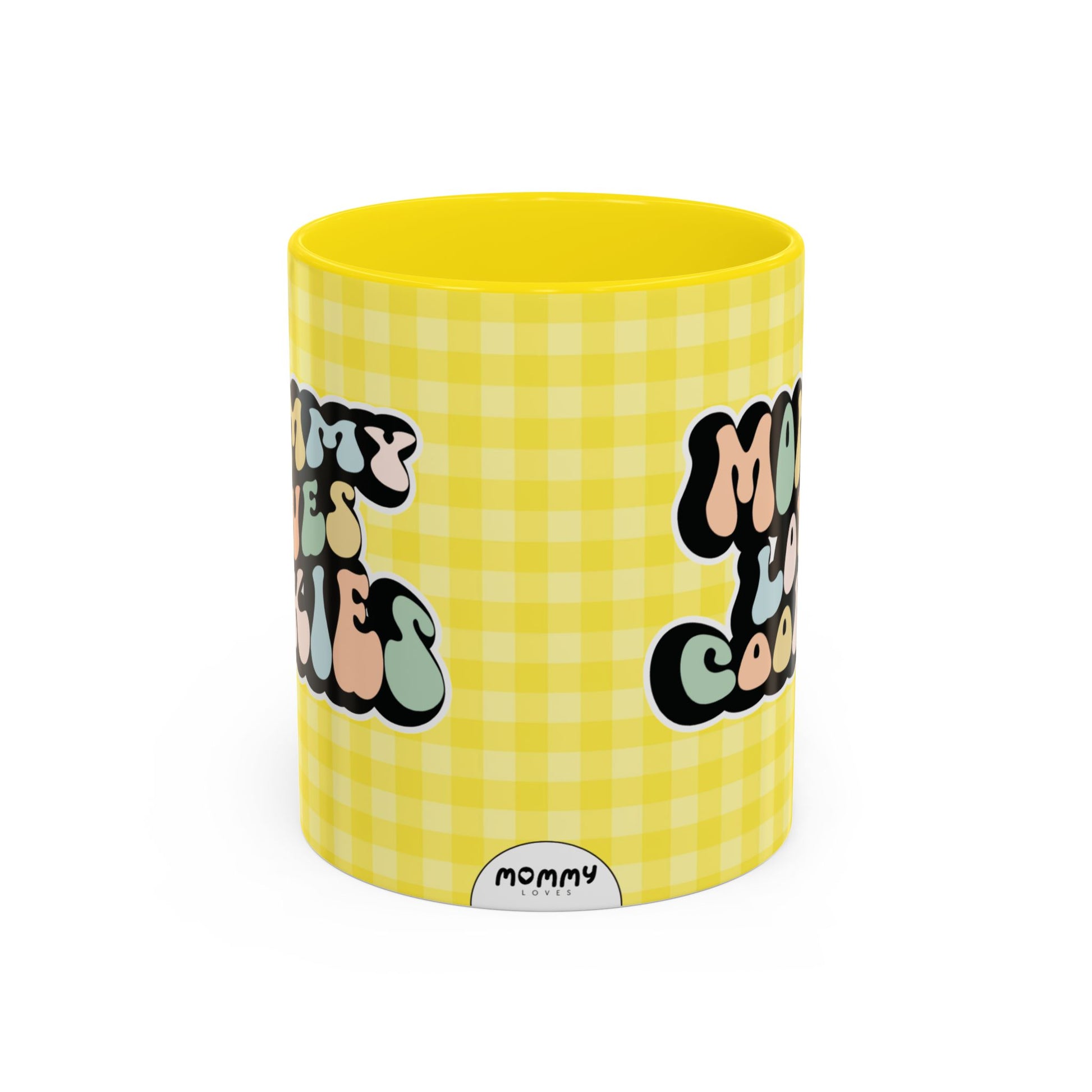 Perfect gift for mom. A decorative, 11oz ceramic mug. It’s wrapped in a yellow-white checkered background. In a happy and colorful 70s retro-style font it says Mommy Loves Cookies, on both sides.