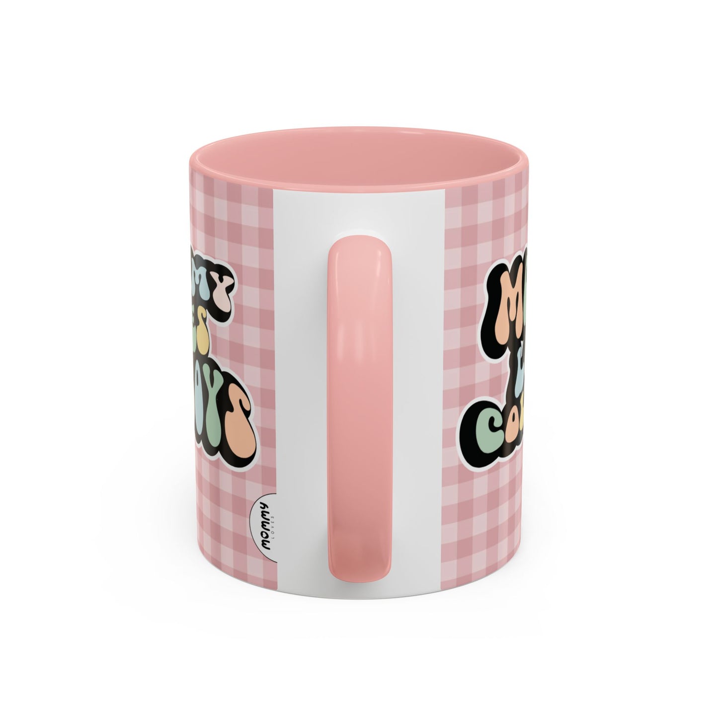Perfect gift for mom. A decorative, 11oz ceramic mug. It’s wrapped in a soft pink-white checkered background. In a happy and colorful 70s retro-style font it says Mommy Loves Cowboys, on both sides.