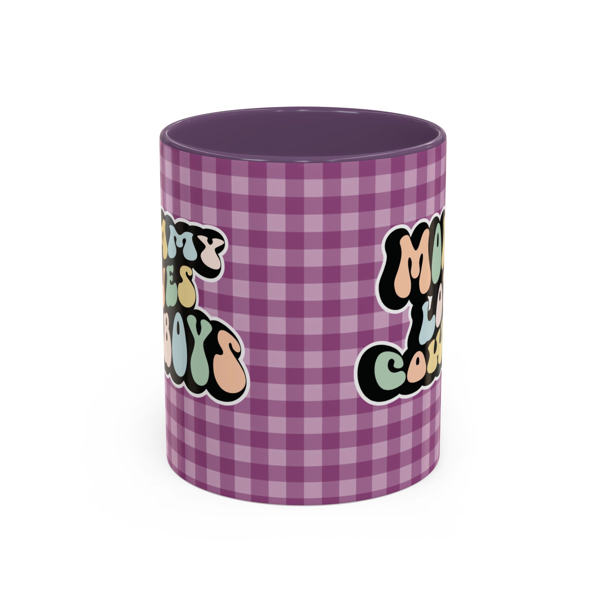 Perfect gift for mom. A decorative, 11oz ceramic mug. It’s wrapped in a purple-white checkered background. In a happy and colorful 70s retro-style font it says Mommy Loves Cowboys, on both sides.