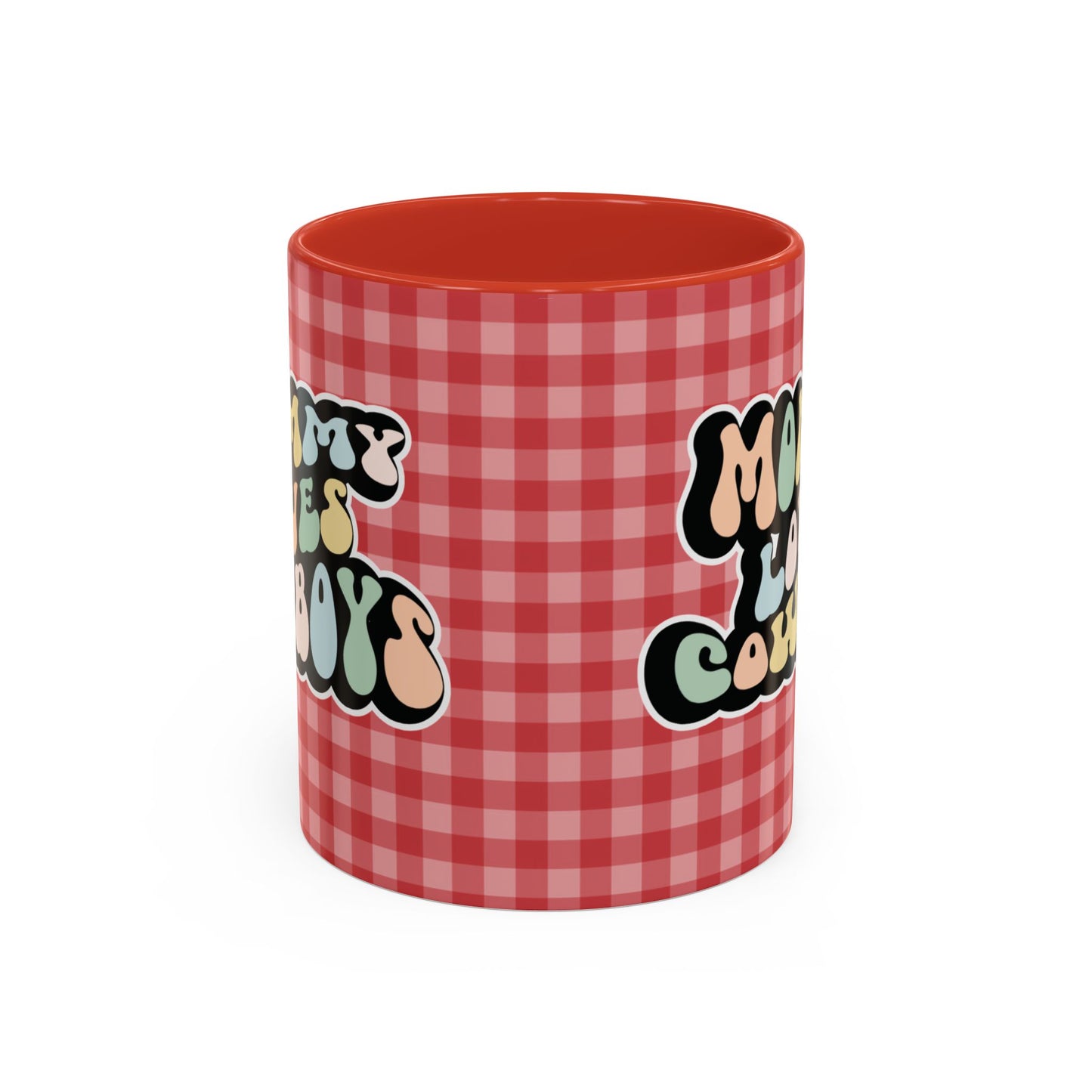 Perfect gift for mom. A decorative, 11oz ceramic mug. It’s wrapped in a red-white checkered background. In a happy and colorful 70s retro-style font it says Mommy Loves Cowboys, on both sides.