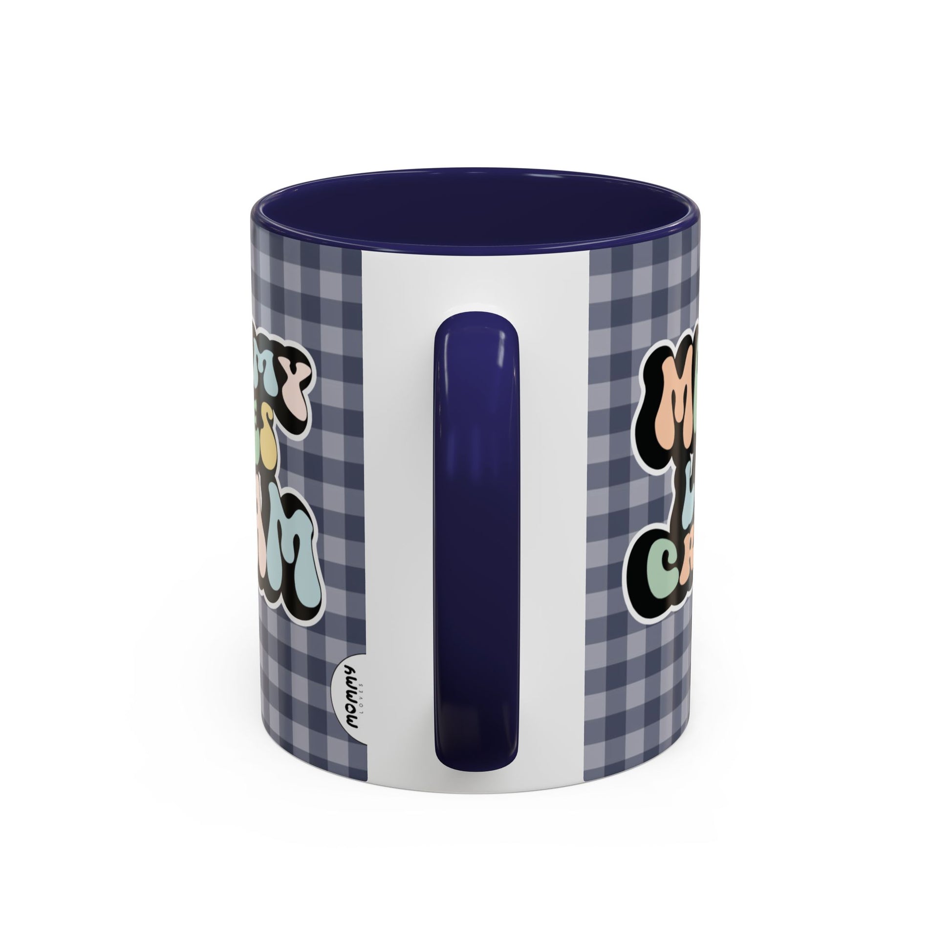 Perfect gift for mom. A decorative, 11oz ceramic mug. It’s wrapped in a navy blue-white checkered background. In a happy and colorful 70s retro-style font it says Mommy Loves Cream, on both sides.