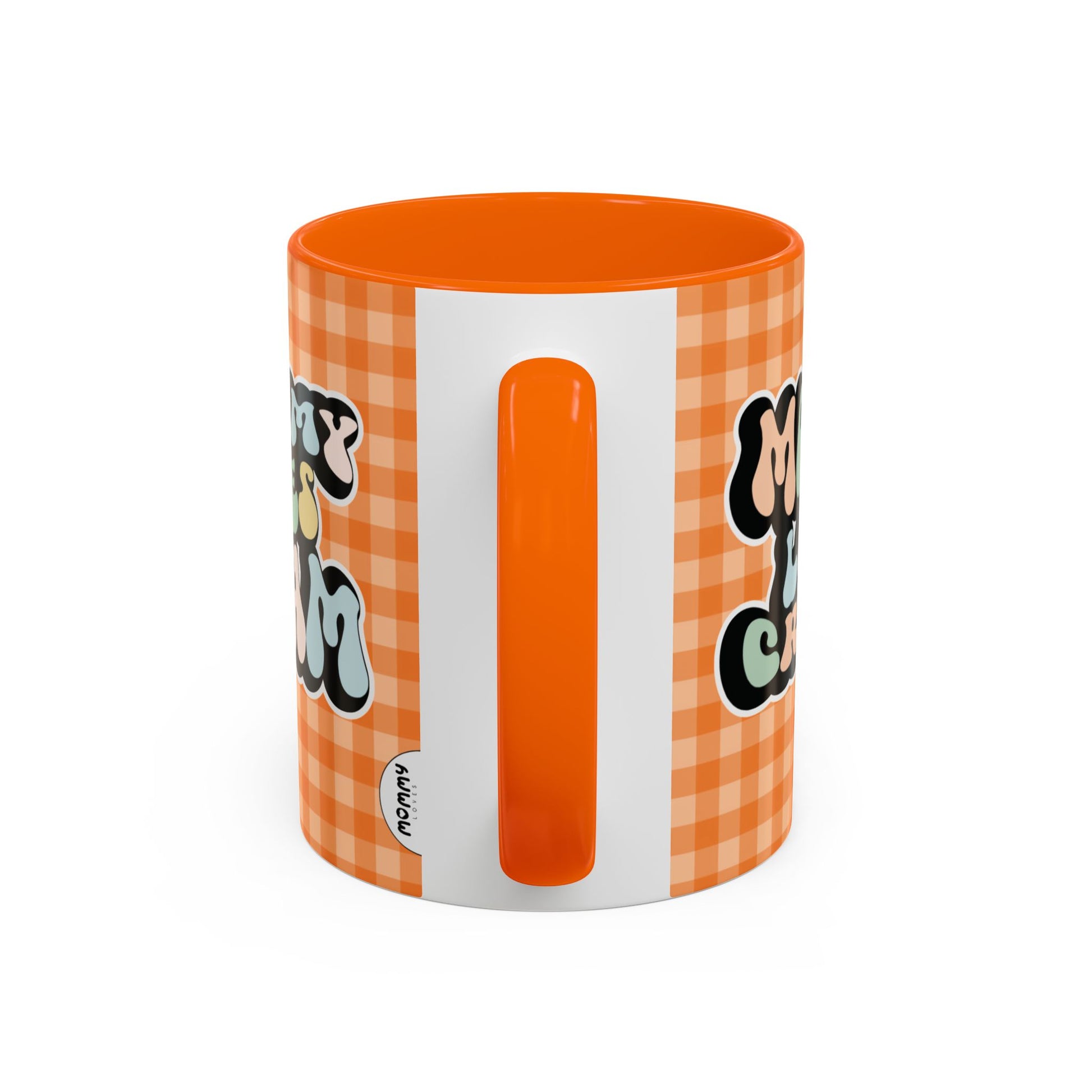 Perfect gift for mom. A decorative, 11oz ceramic mug. It’s wrapped in a orange-white checkered background. In a happy and colorful 70s retro-style font it says Mommy Loves Cream, on both sides.