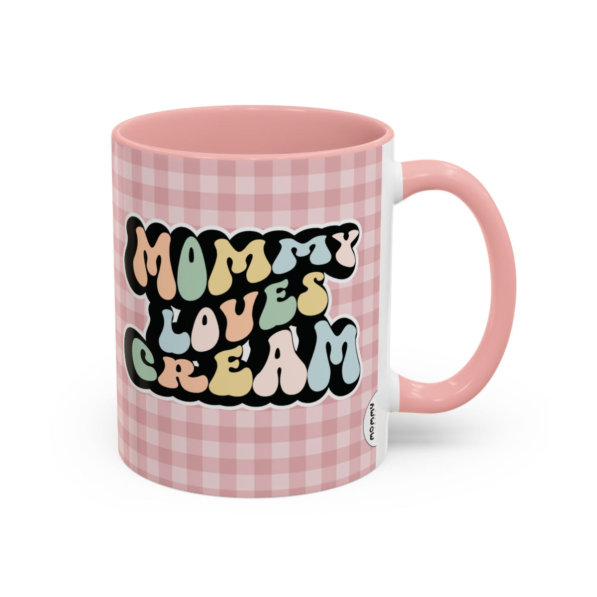 Perfect gift for mom. A decorative, 11oz ceramic mug. It’s wrapped in a soft pink-white checkered background. In a happy and colorful 70s retro-style font it says Mommy Loves Cream, on both sides.