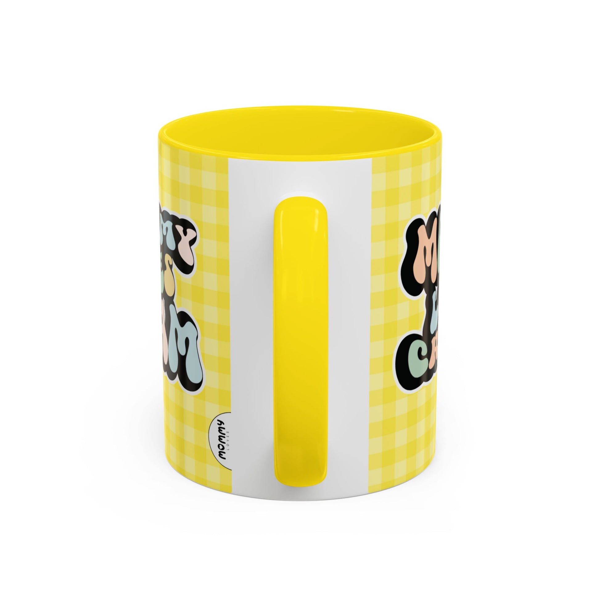 Perfect gift for mom. A decorative, 11oz ceramic mug. It’s wrapped in a yellow-white checkered background. In a happy and colorful 70s retro-style font it says Mommy Loves Cream, on both sides.
