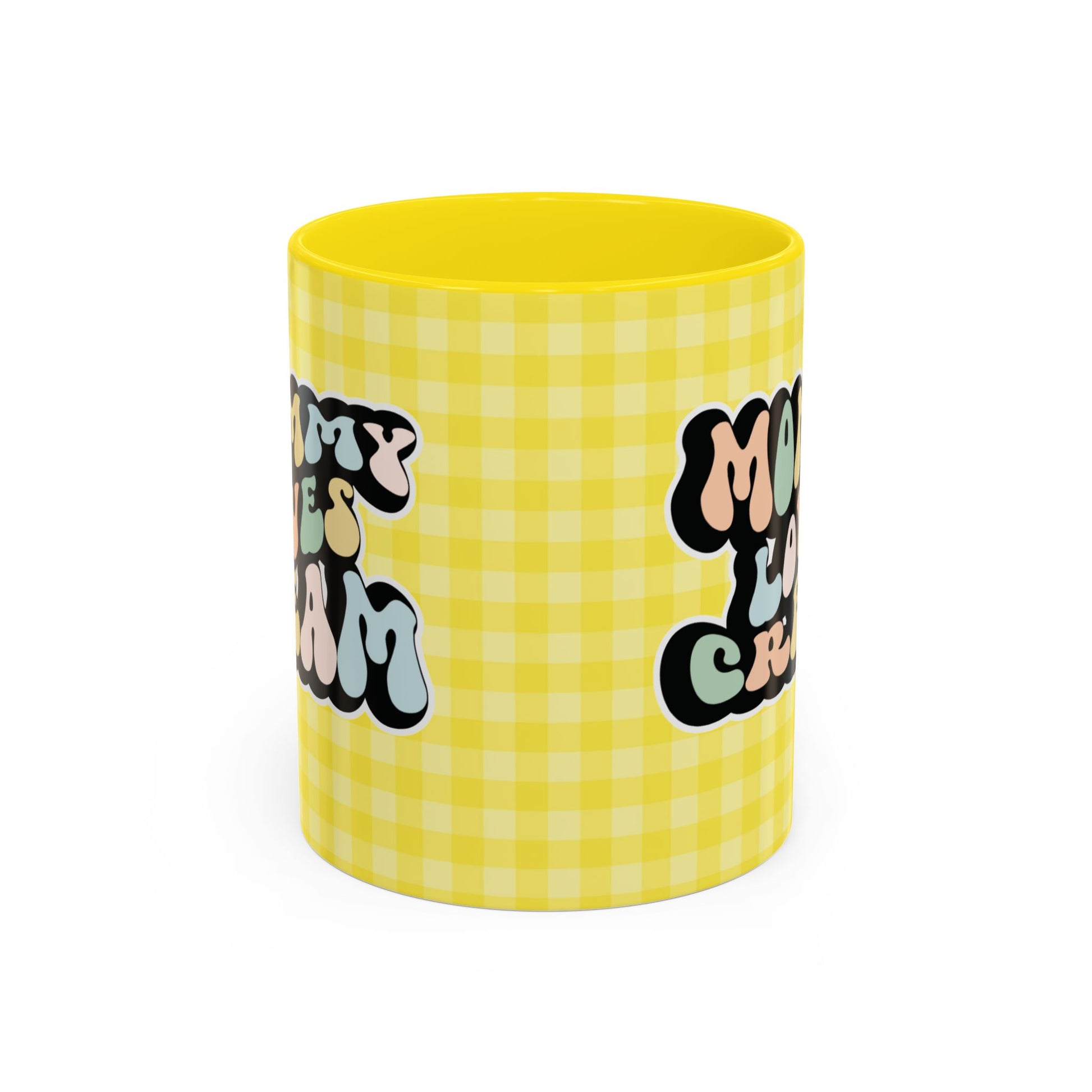 Perfect gift for mom. A decorative, 11oz ceramic mug. It’s wrapped in a yellow-white checkered background. In a happy and colorful 70s retro-style font it says Mommy Loves Cream, on both sides.