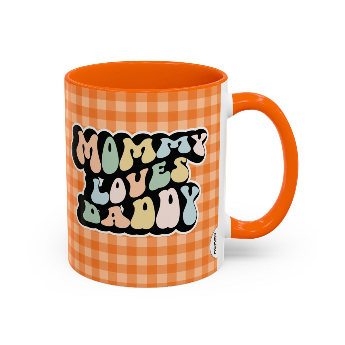 Perfect gift for mom. A decorative, 11oz ceramic mug. It’s wrapped in a orange-white checkered background. In a happy and colorful 70s retro-style font it says Mommy Loves Daddy, on both sides.