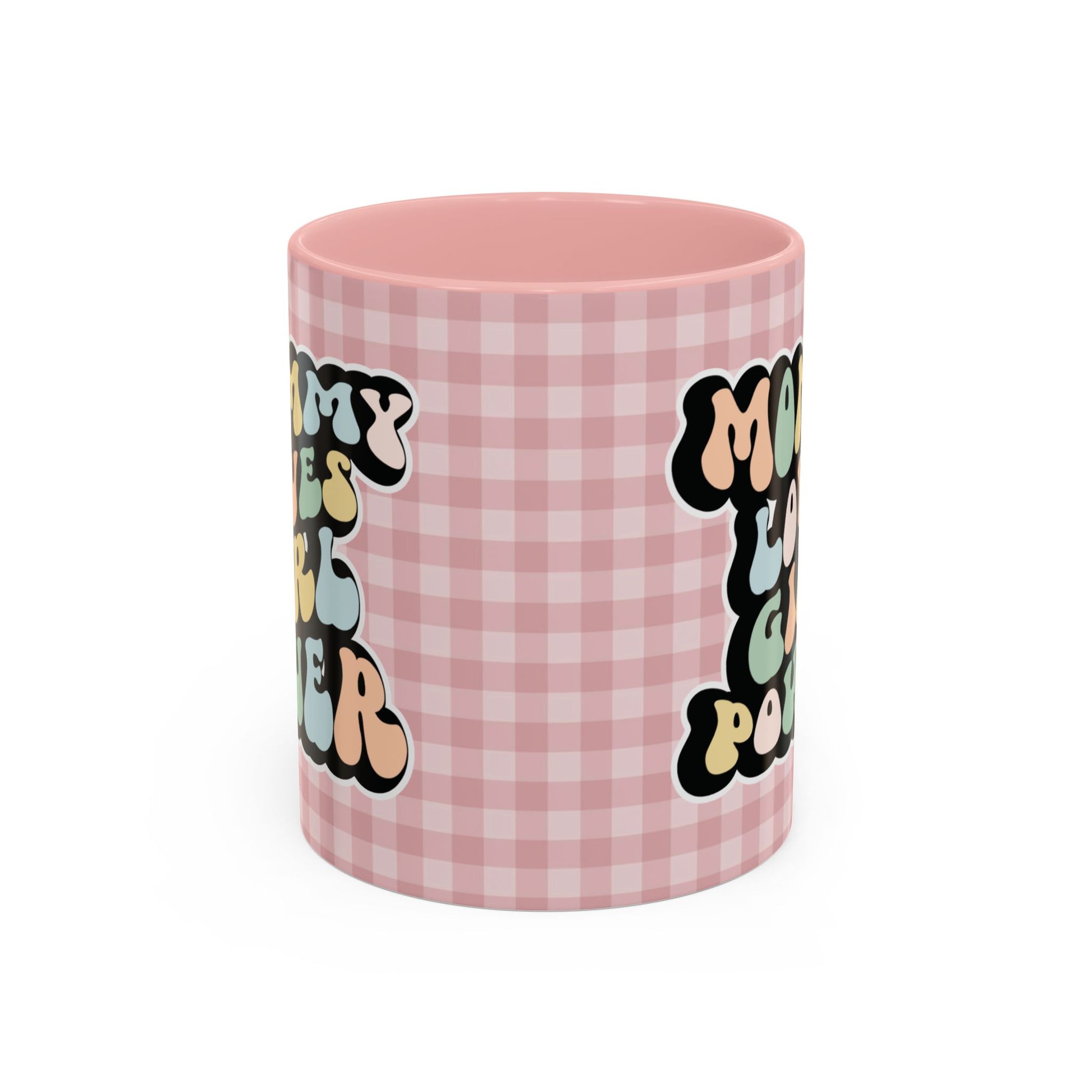 Perfect gift for mom. A decorative, 11oz ceramic mug. It’s wrapped in a soft pink-white checkered background. In a happy and colorful 70s retro-style font it says Mommy Loves Girl Power, on both sides.