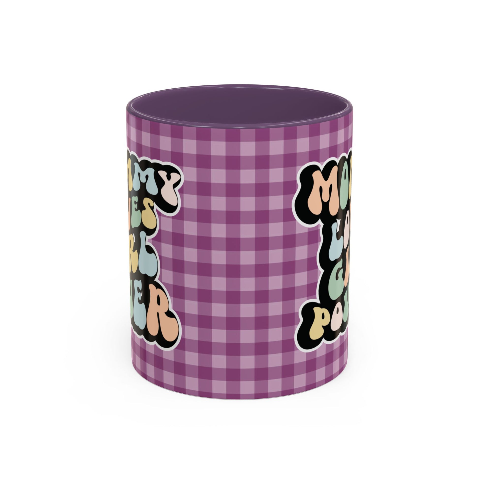 Perfect gift for mom. A decorative, 11oz ceramic mug. It’s wrapped in a purple-white checkered background. In a happy and colorful 70s retro-style font it says Mommy Loves Girl Power, on both sides.