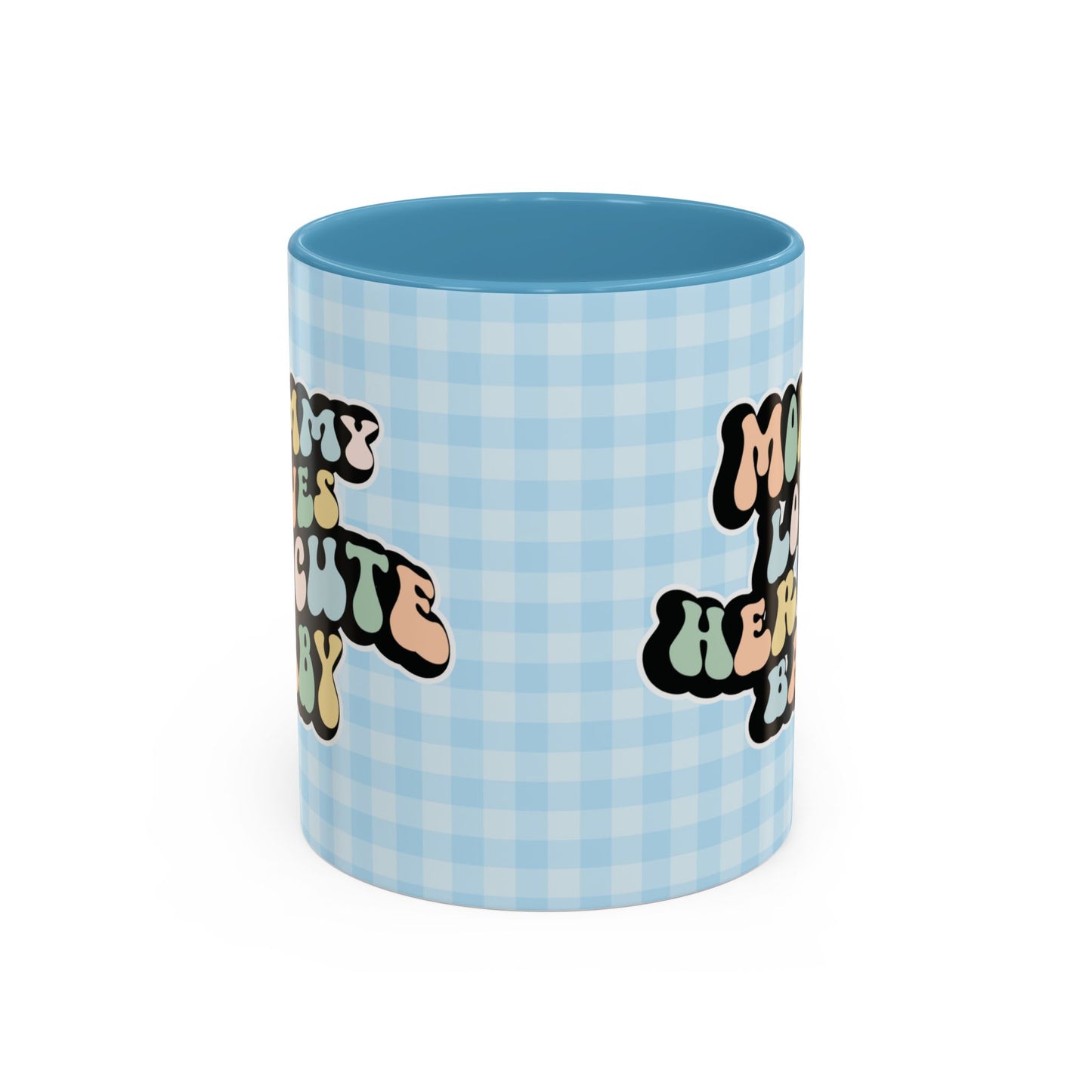 Perfect gift for mom. A decorative, 11oz ceramic mug. It’s wrapped in a light blue-white checkered background. In a happy and colorful 70s retro-style font it says Mommy Loves Her Cute Baby, on both sides.