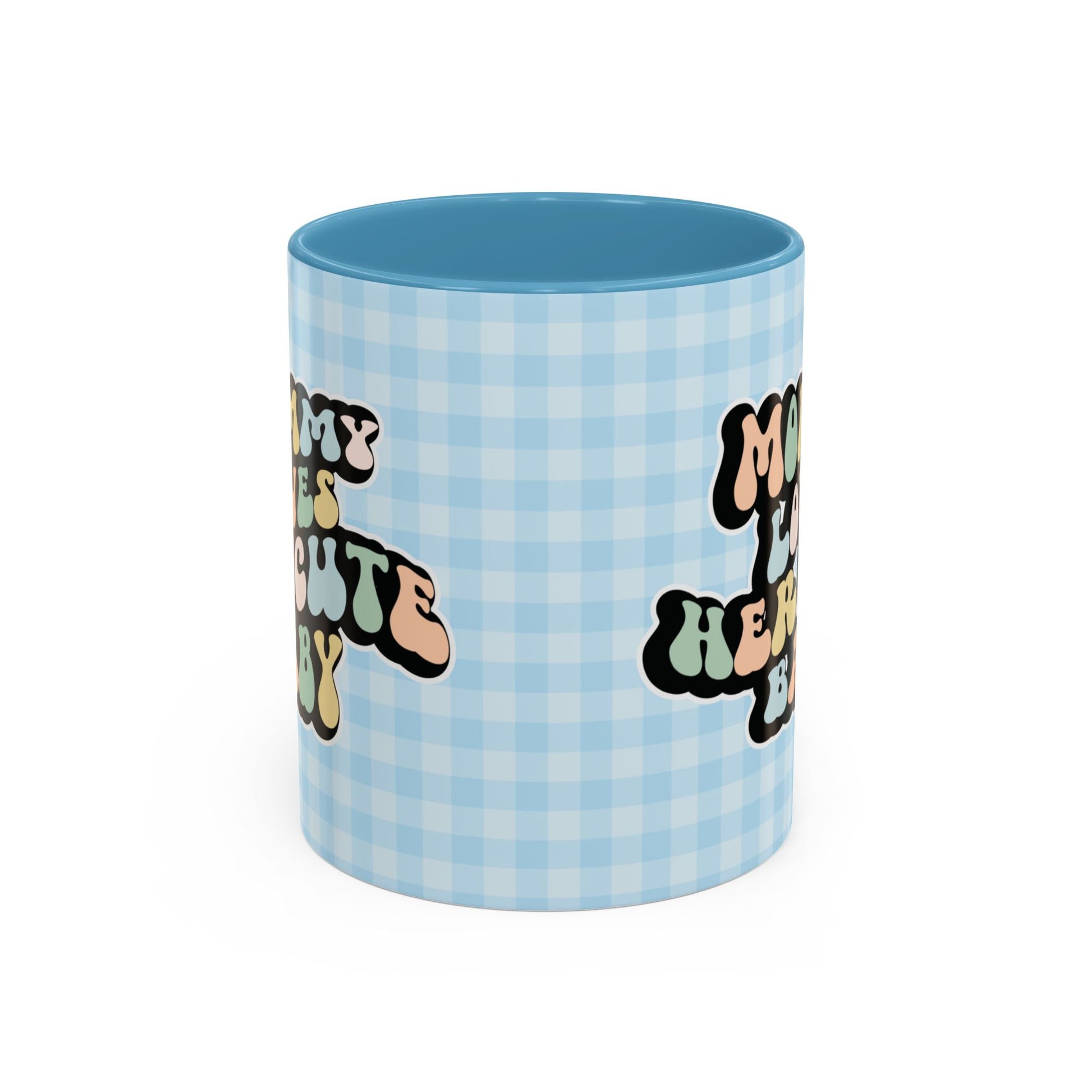 Perfect gift for mom. A decorative, 11oz ceramic mug. It’s wrapped in a light blue-white checkered background. In a happy and colorful 70s retro-style font it says Mommy Loves Her Cute Baby, on both sides.