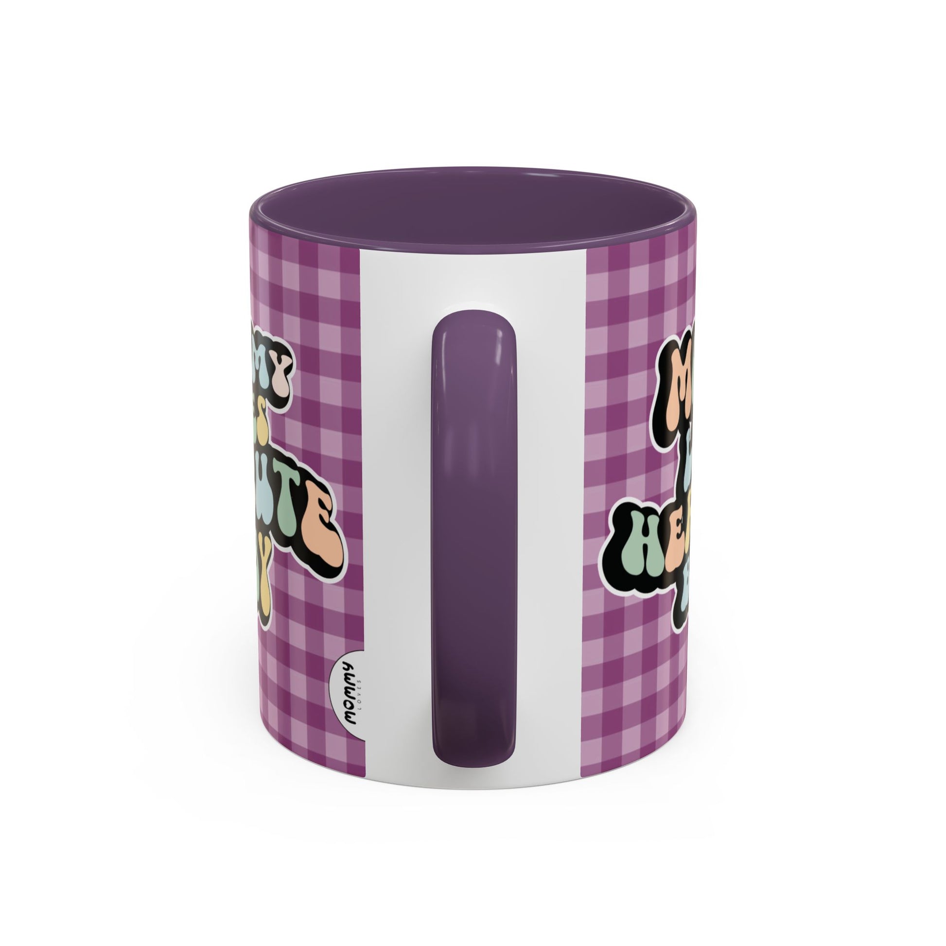 Perfect gift for mom. A decorative, 11oz ceramic mug. It’s wrapped in a purple-white checkered background. In a happy and colorful 70s retro-style font it says Mommy Loves Her Cute Baby, on both sides.