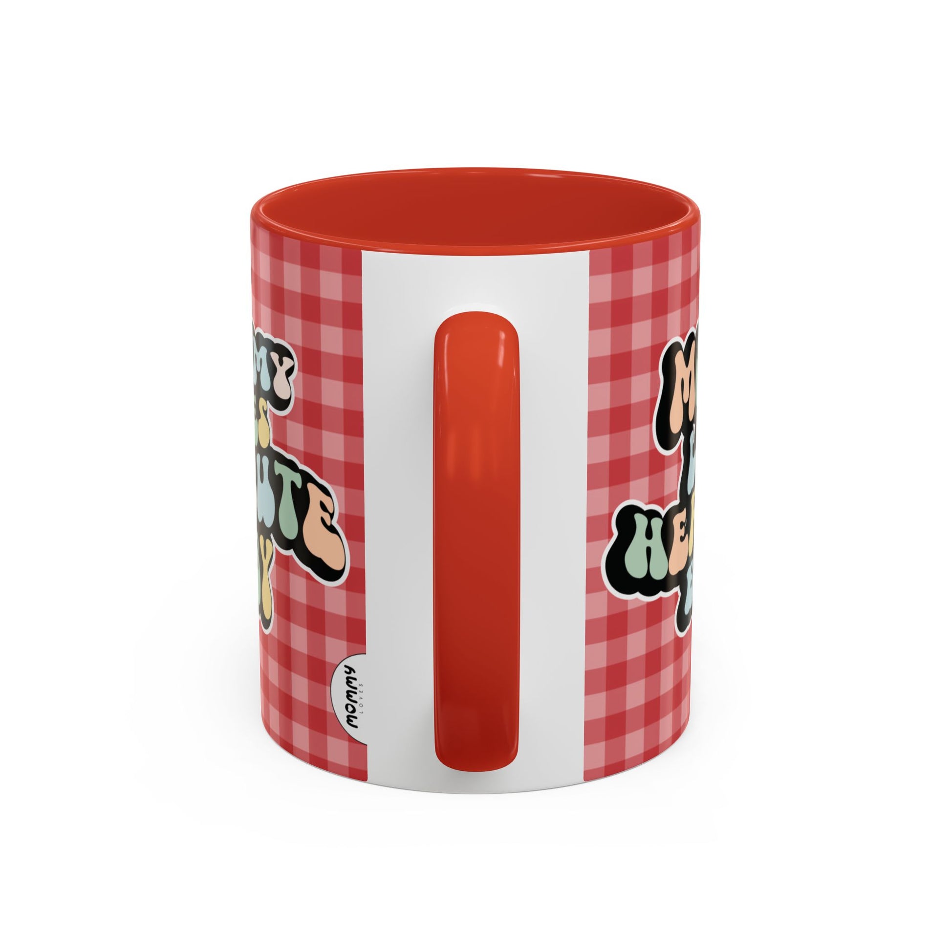 Perfect gift for mom. A decorative, 11oz ceramic mug. It’s wrapped in a red-white checkered background. In a happy and colorful 70s retro-style font it says Mommy Loves Her Cute Baby, on both sides.