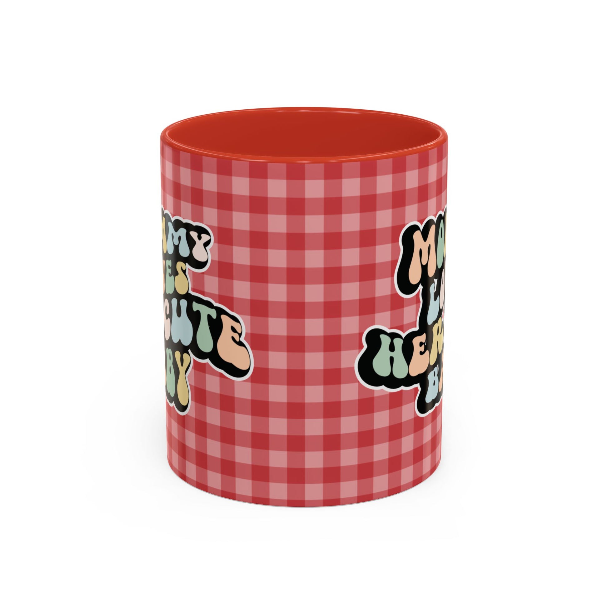 Perfect gift for mom. A decorative, 11oz ceramic mug. It’s wrapped in a red-white checkered background. In a happy and colorful 70s retro-style font it says Mommy Loves Her Cute Baby, on both sides.