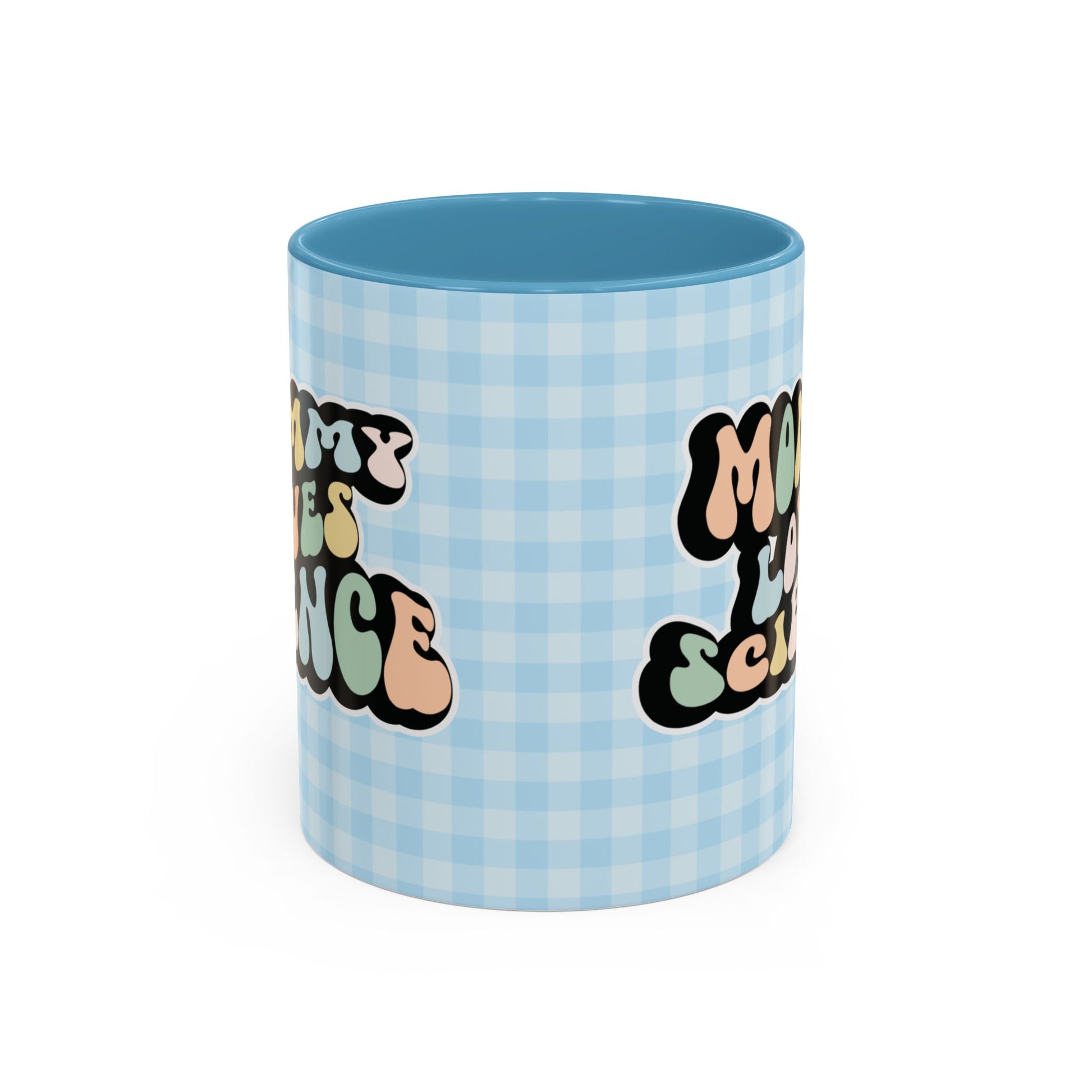 Perfect gift for mom. A decorative, 11oz ceramic mug. It’s wrapped in a light blue-white checkered background. In a happy and colorful 70s retro-style font it says Mommy Loves Science, on both sides.