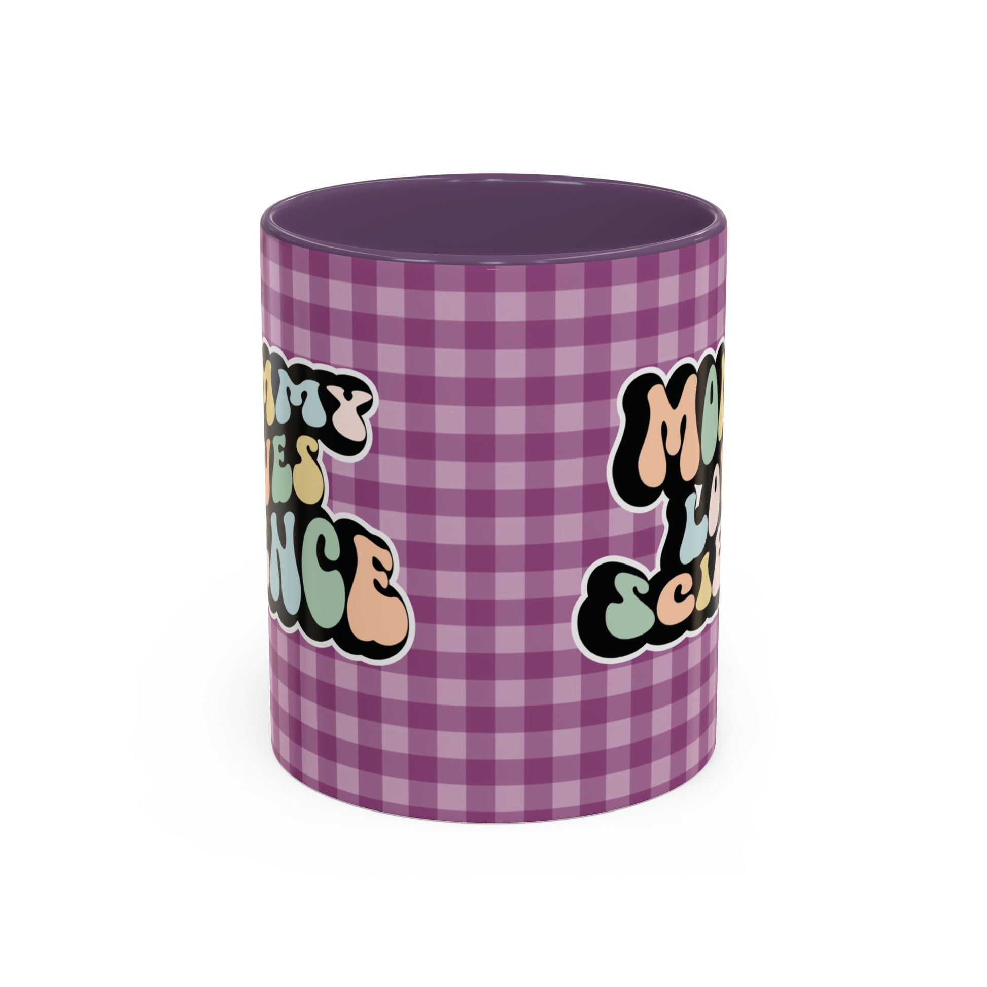 Perfect gift for mom. A decorative, 11oz ceramic mug. It’s wrapped in a purple-white checkered background. In a happy and colorful 70s retro-style font it says Mommy Loves Science, on both sides.