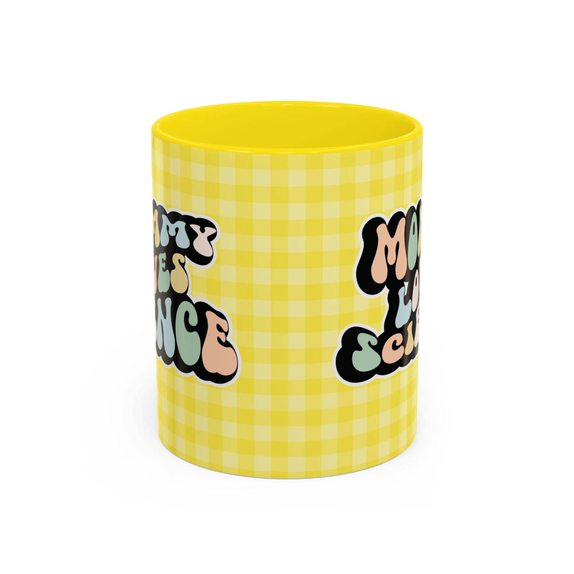 Perfect gift for mom. A decorative, 11oz ceramic mug. It’s wrapped in a yellow-white checkered background. In a happy and colorful 70s retro-style font it says Mommy Loves Science, on both sides.
