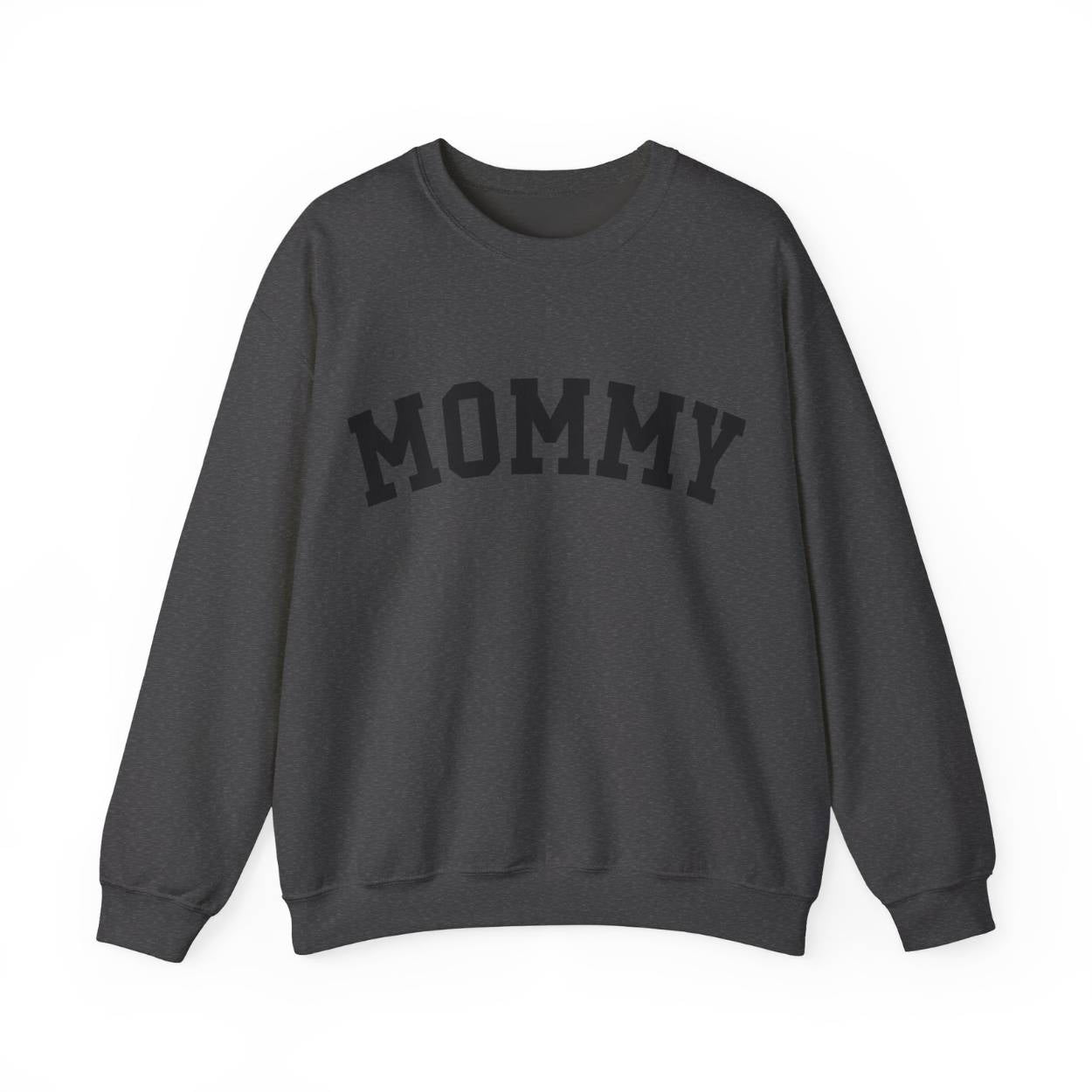 The perfect gift for mom. Our Mother’s Day special. Our crewneck sweatshirt. The color of the shirt is dark heather, and in big black varsity letters it says MOMMY on the chest. It’s available in six sizes, ranging from S to 3XL.