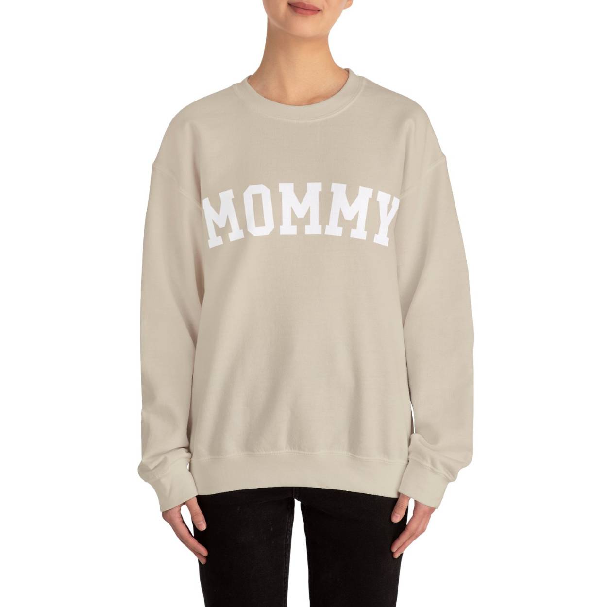 The perfect gift for mom. Our Mother’s Day special. The model is wearing our sand-colored crewneck sweatshirt. In big white varsity letters it says MOMMY on the chest.