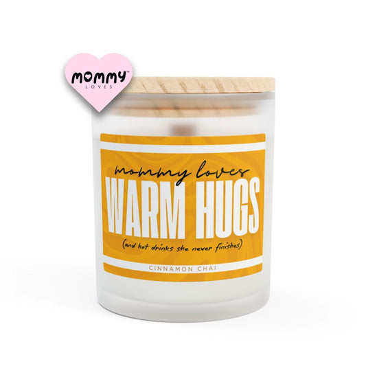 The perfect gift for mom, especially for mother's day. A frosted glass scented candle, with a wooden lid. The glass vessel is 11 oz, and the wax is 9oz. Burning time is around 50 hours. The label is beautifully designed in light brown, creamy colors, and it says: Mommy Loves Warm Hugs. Underneath, in between brackets it says: and hot drinks she never finishes. A funny, yet original gift for mom! The scent is cinnamon chai. Super relaxing.