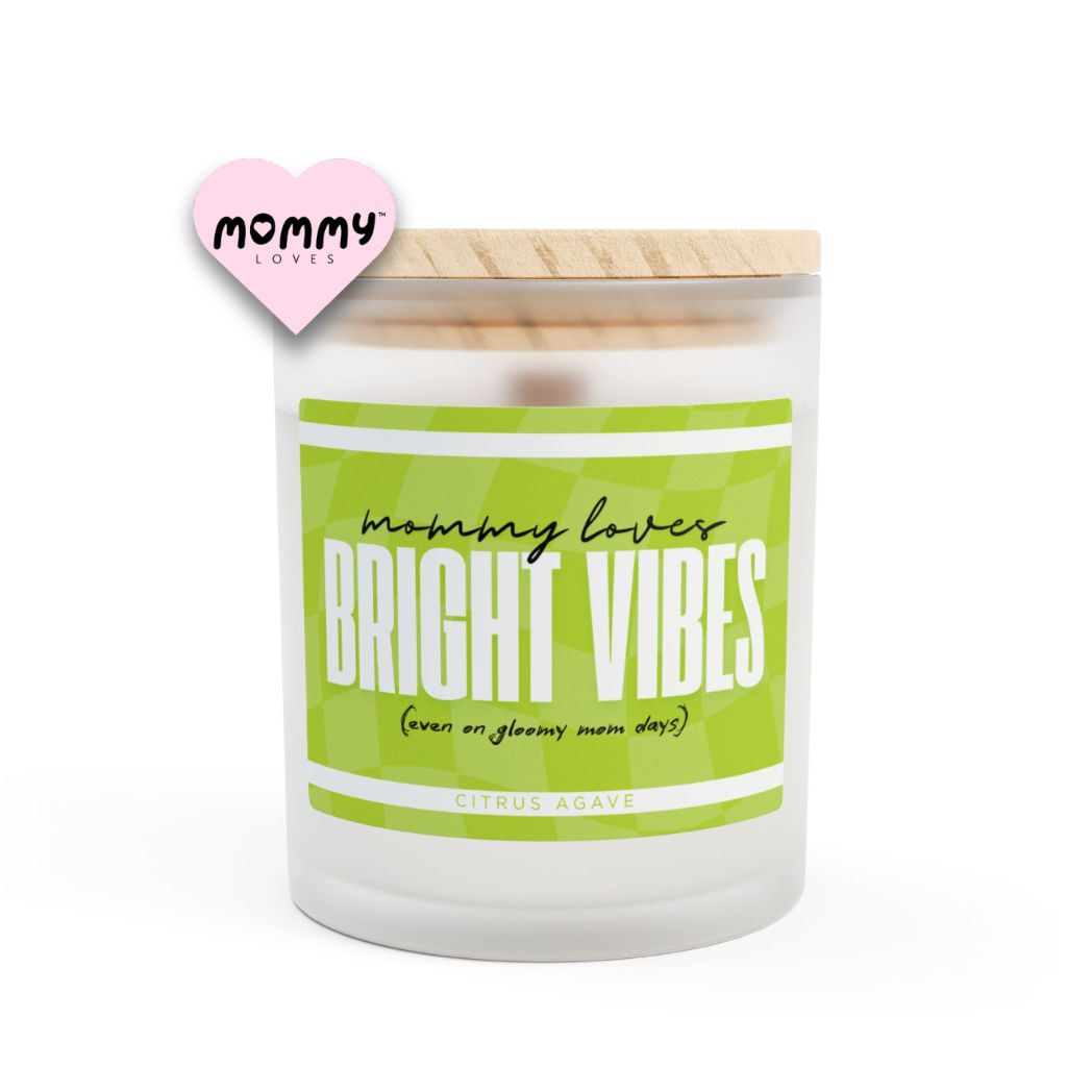 The perfect gift for mom, especially for mother's day. A frosted glass scented candle, with a wooden lid. The glass vessel is 11 oz, and the wax is 9oz. Burning time is around 50 hours. The label is beautifully designed in light green colors, and it says: Mommy Loves Bright Vibes. Underneath, in between brackets it says: even on gloomy mom days. A funny, yet original gift for mom! The scent is citrus agave, which is can be considered energizing.
