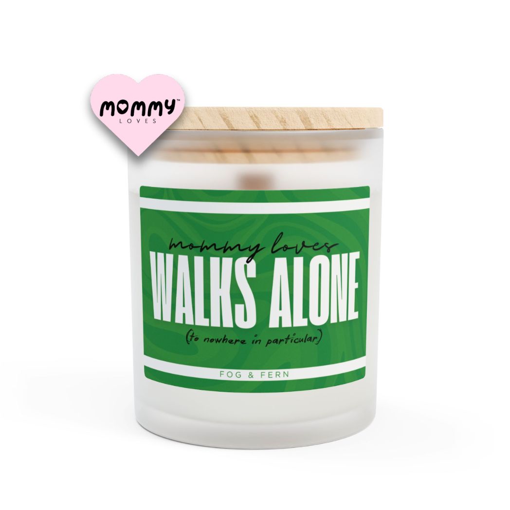 The perfect gift for mom, especially for mother's day. A frosted glass scented candle, with a wooden lid. The glass vessel is 11 oz, and the wax is 9oz. Burning time is around 50 hours. The label is beautifully designed in green colors, and it says: Mommy Loves Walks Alone. Underneath, in between brackets it says: to nowhere in particular. A funny, yet original gift for mom! The scent is fog & fern. Super relaxing.