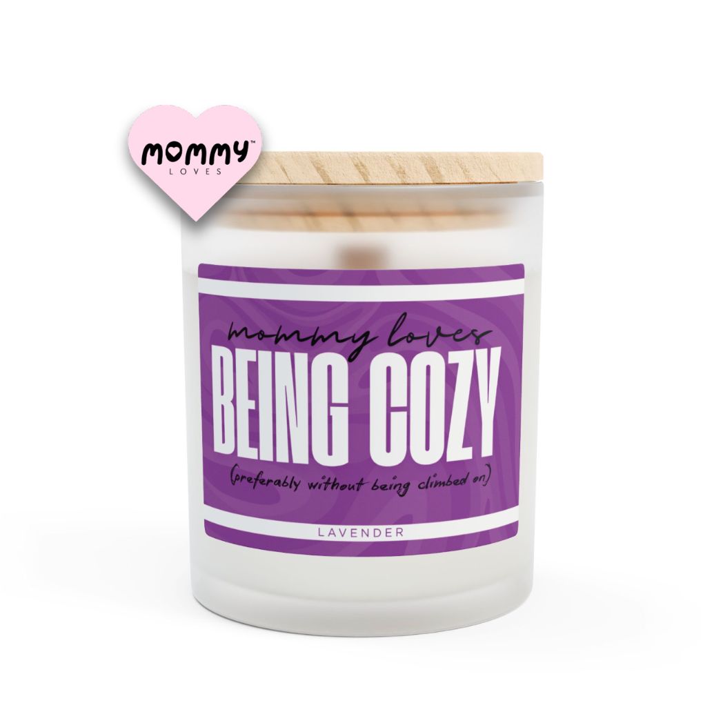 The perfect gift for mom, especially for mother's day. A frosted glass scented candle, with a wooden lid. The glass vessel is 11 oz, and the wax is 9oz. Burning time is around 50 hours. The label is beautifully designed in purple colors, and it says: Mommy Loves being cozy. Underneath, in between brackets it says: preferably without being climbed on. A funny, yet original gift for mom! The fragrance is lavender. Super relaxing.