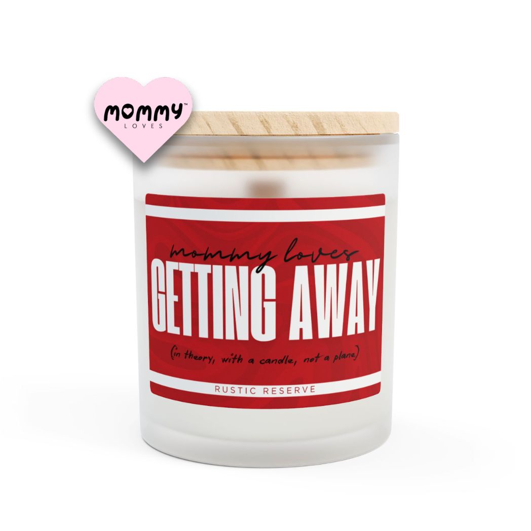 The perfect gift for mom, especially for mother's day. A frosted glass scented candle, with a wooden lid. The glass vessel is 11 oz, and the wax is 9oz. Burning time is around 50 hours. The label is beautifully designed in hints of red colors, and it says: Mommy Loves Getting Away. Underneath, in between brackets it says: in theory, with a candle, not a plane. A funny, yet original gift for mom! The fragrance is Rustic Reserve, which has hints of Tobacco, vanilla and lavender. Super relaxing.
