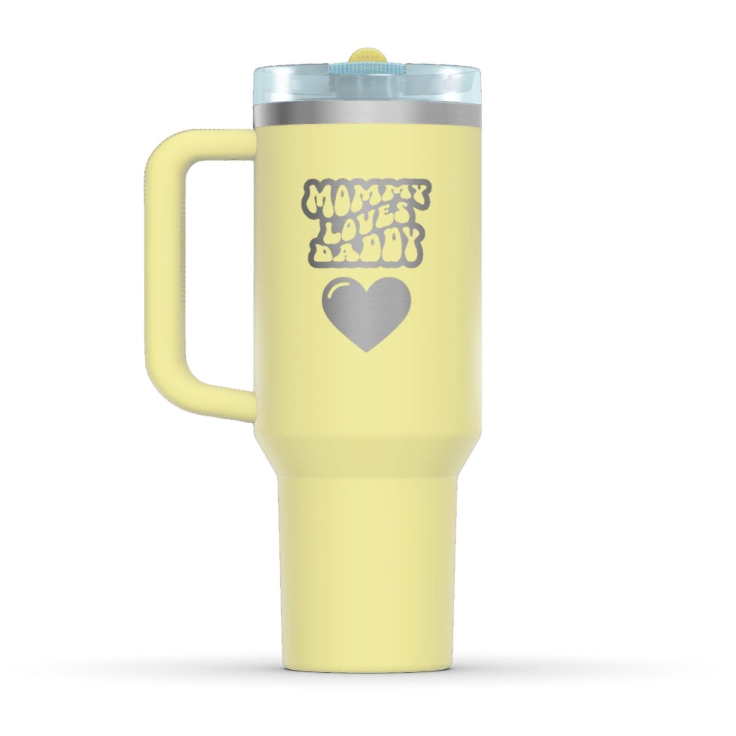 The back side of the newest Stanley 40oz Tumbler. The perfect gift for mom. The Color of the cup is Pomelo, a shade of fresh yellow. It’s engraved with a typically 70s retro-style font, saying Mommy Loves Daddy. Under that text there is a nice big heart in the same retro style.