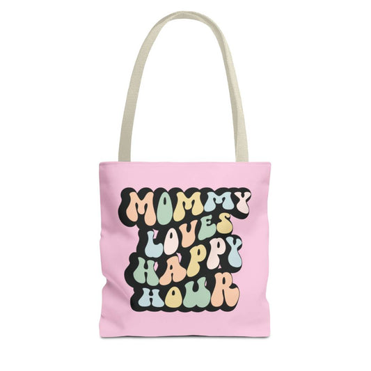 Perfect gift for mom. A pink tote bag, available in three sizes. In a typically 70s retro-style font, it says Mommy Loves Happy Hour. The handle is beige.