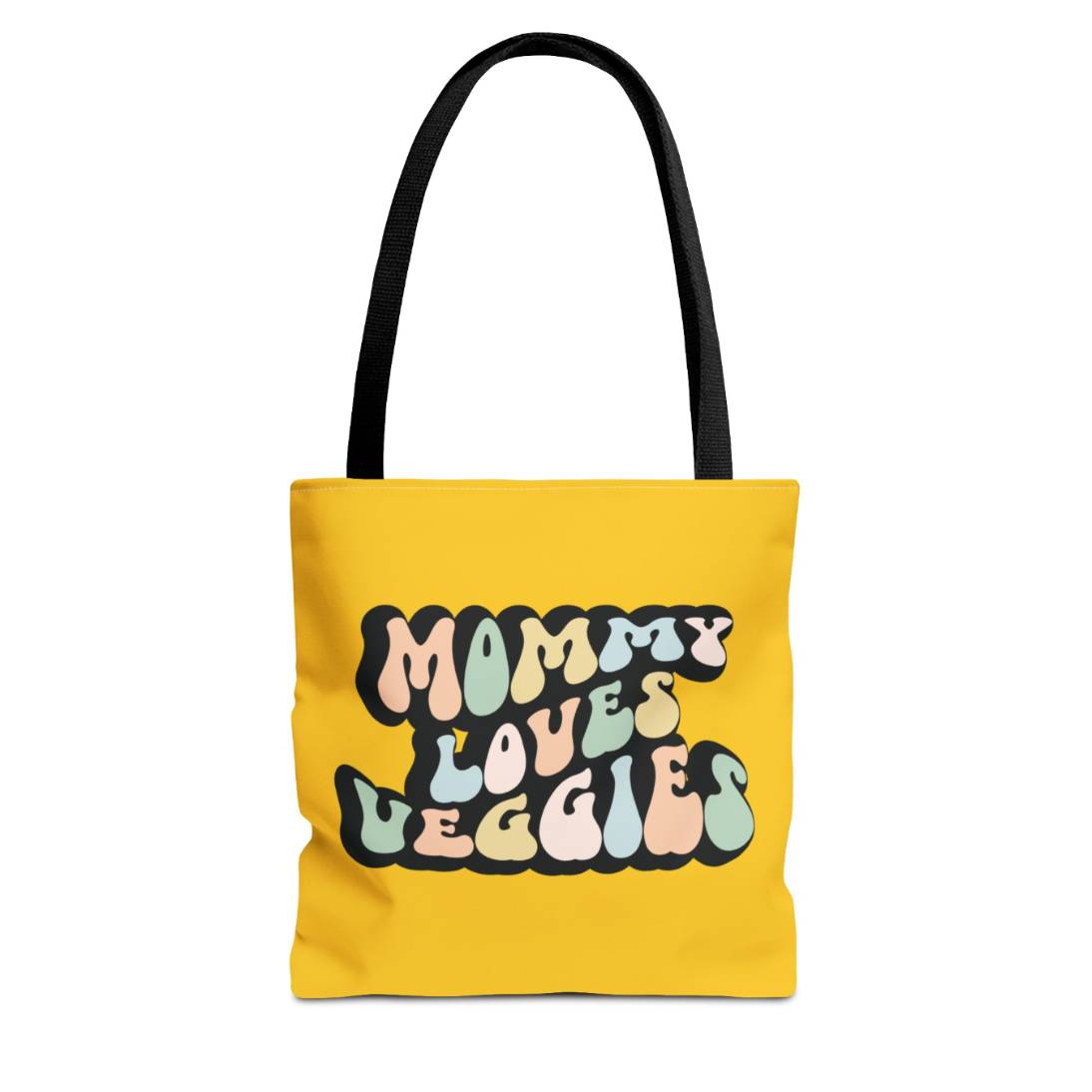 Perfect gift for mom. A mustard yellow tote bag, available in three sizes. In a typically 70s retro-style font, it says Mommy Loves Veggies. The handle is black.