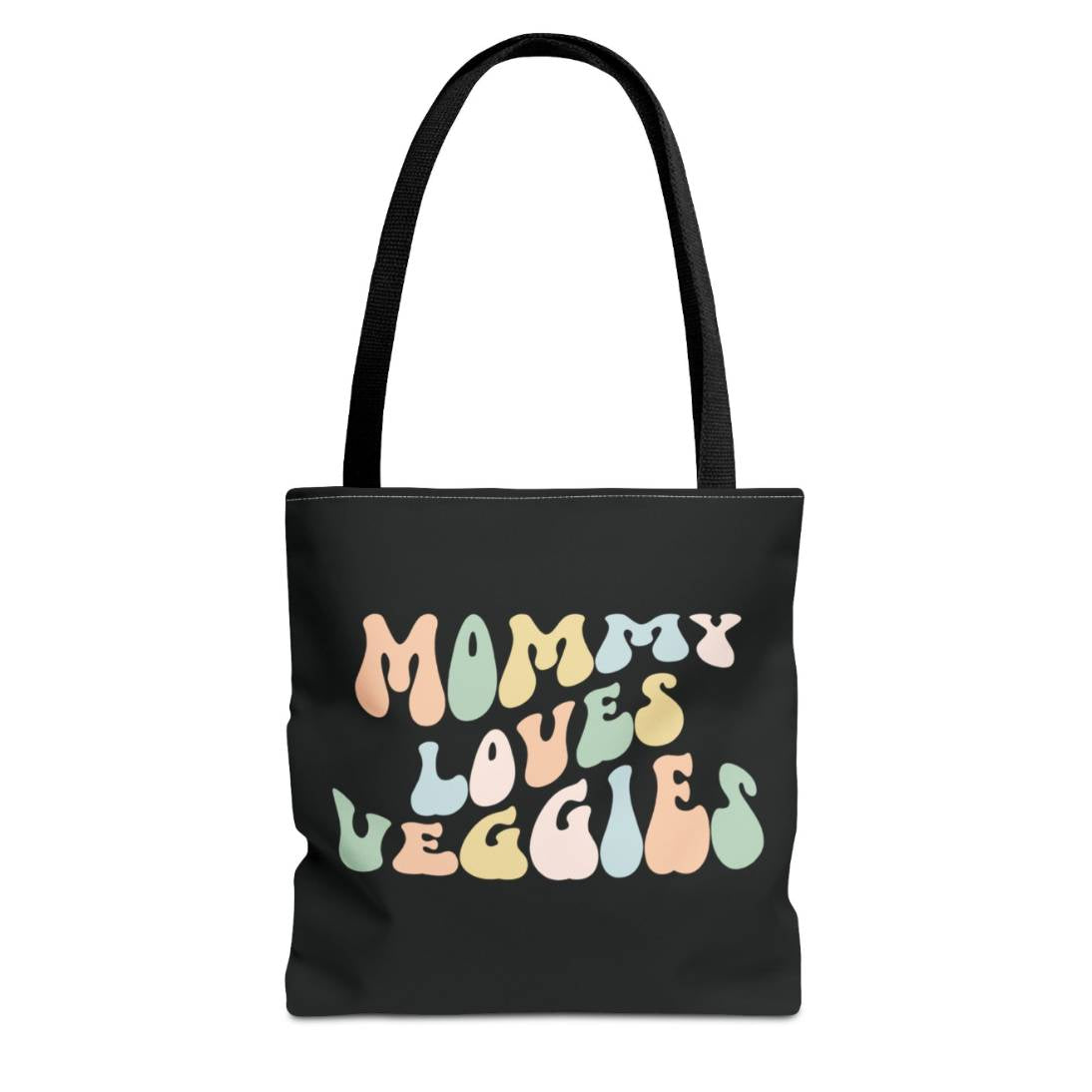 Perfect gift for mom. A black tote bag, available in three sizes. In a typically 70s retro-style font, it says Mommy Loves Veggies. The handle is black.