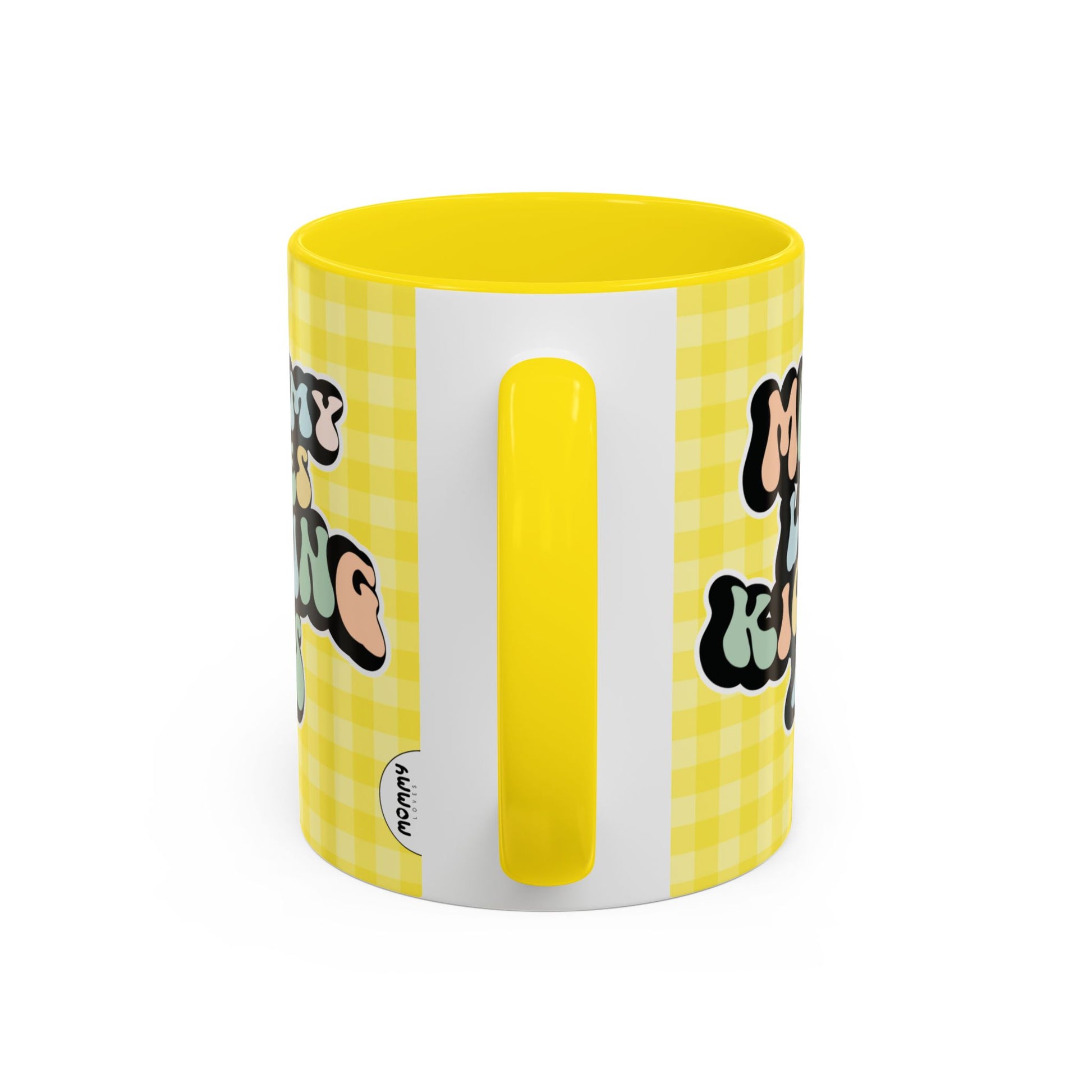 Perfect gift for mom. A decorative, 11oz ceramic mug. It’s wrapped in a yellow-white checkered background. In a happy and colorful 70s retro-style font it says Mommy Loves Kicking Ass on both sides. 