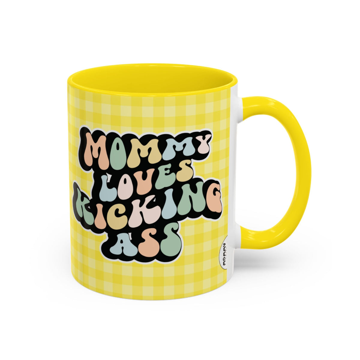 Perfect gift for mom. A decorative, 11oz ceramic mug. It’s wrapped in a yellow-white checkered background. In a happy and colorful 70s retro-style font it says Mommy Loves Kicking Ass on both sides. 