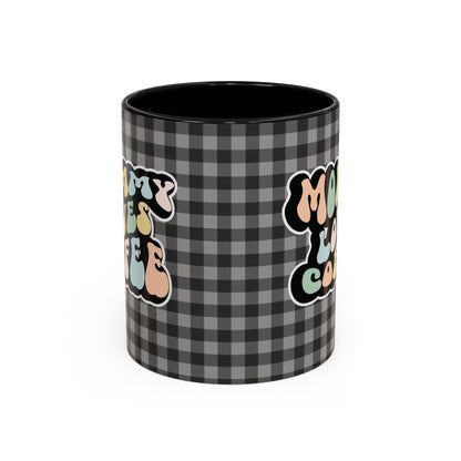 Perfect gift for mom. A decorative, 11oz ceramic mug. It’s wrapped in a black-white checkered background. In a happy and colorful 70s retro-style font it says Mommy Loves Coffee, on both sides. 