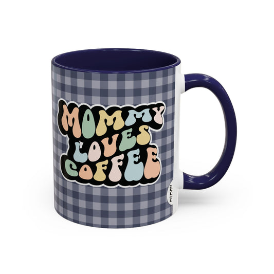 Perfect gift for mom. A decorative, 11oz ceramic mug. It’s wrapped in a navy blue-white checkered background. In a happy, typically 70s retro-style font, it says Mommy Loves Coffee. 