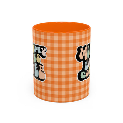 Perfect gift for mom. A decorative, 11oz ceramic mug. It’s wrapped in a orange-white checkered background. In a happy and colorful 70s retro-style font it says Mommy Loves Coffee, on both sides. 
