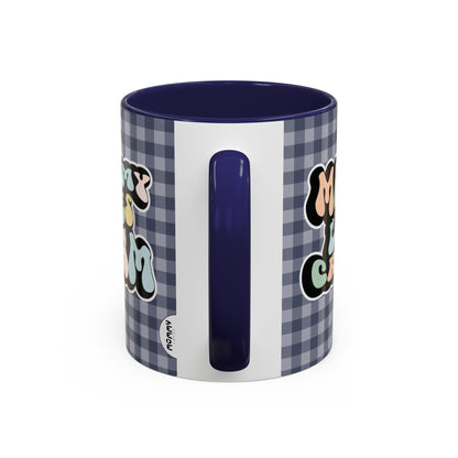 Perfect gift for mom. A decorative, 11oz ceramic mug. It’s wrapped in a navy blue-white checkered background. In a happy and colorful 70s retro-style font it says Mommy Loves Cream, on both sides. 
