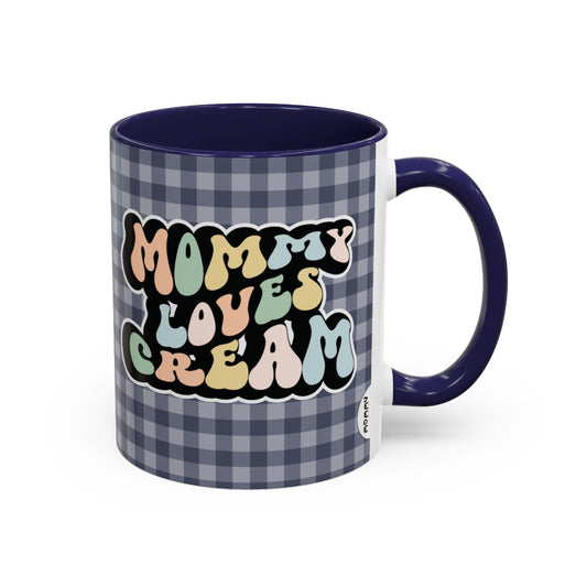 Perfect gift for mom. A decorative, 11oz ceramic mug. It’s wrapped in a navy blue-white checkered background. In a happy and colorful 70s retro-style font it says Mommy Loves Cream, on both sides. 