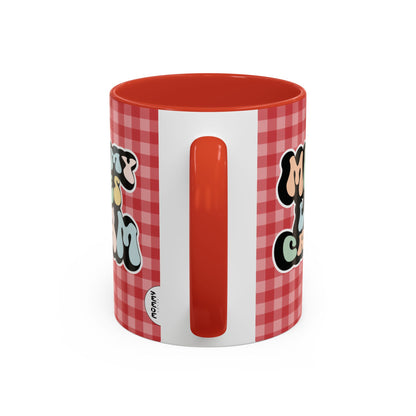 Perfect gift for mom. A decorative, 11oz ceramic mug. It’s wrapped in a red-white checkered background. In a happy and colorful 70s retro-style font it says Mommy Loves Cream, on both sides. 