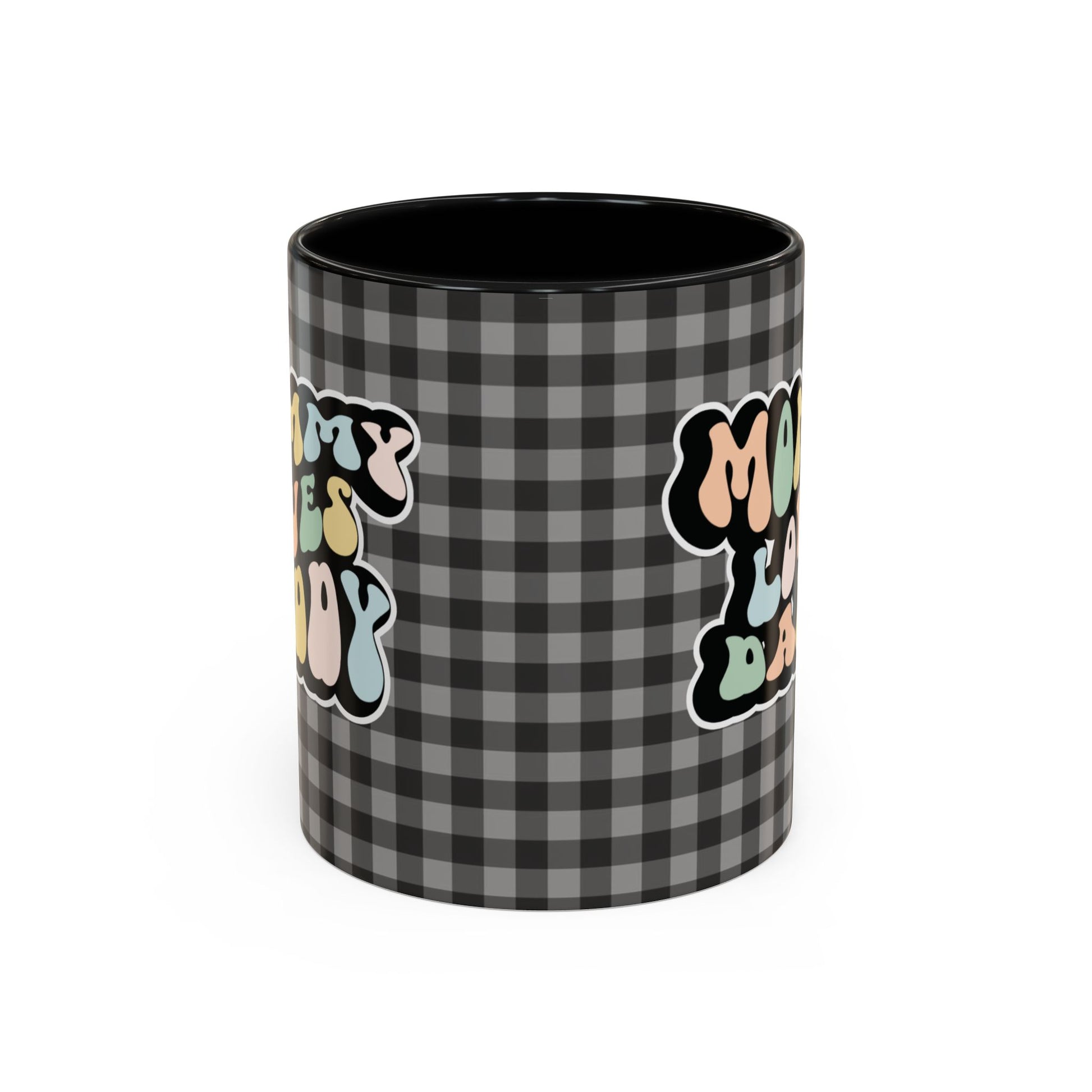 Perfect gift for mom. A decorative, 11oz ceramic mug. It’s wrapped in a black-white checkered background. In a happy and colorful 70s retro-style font it says Mommy Loves Daddy, on both sides. 