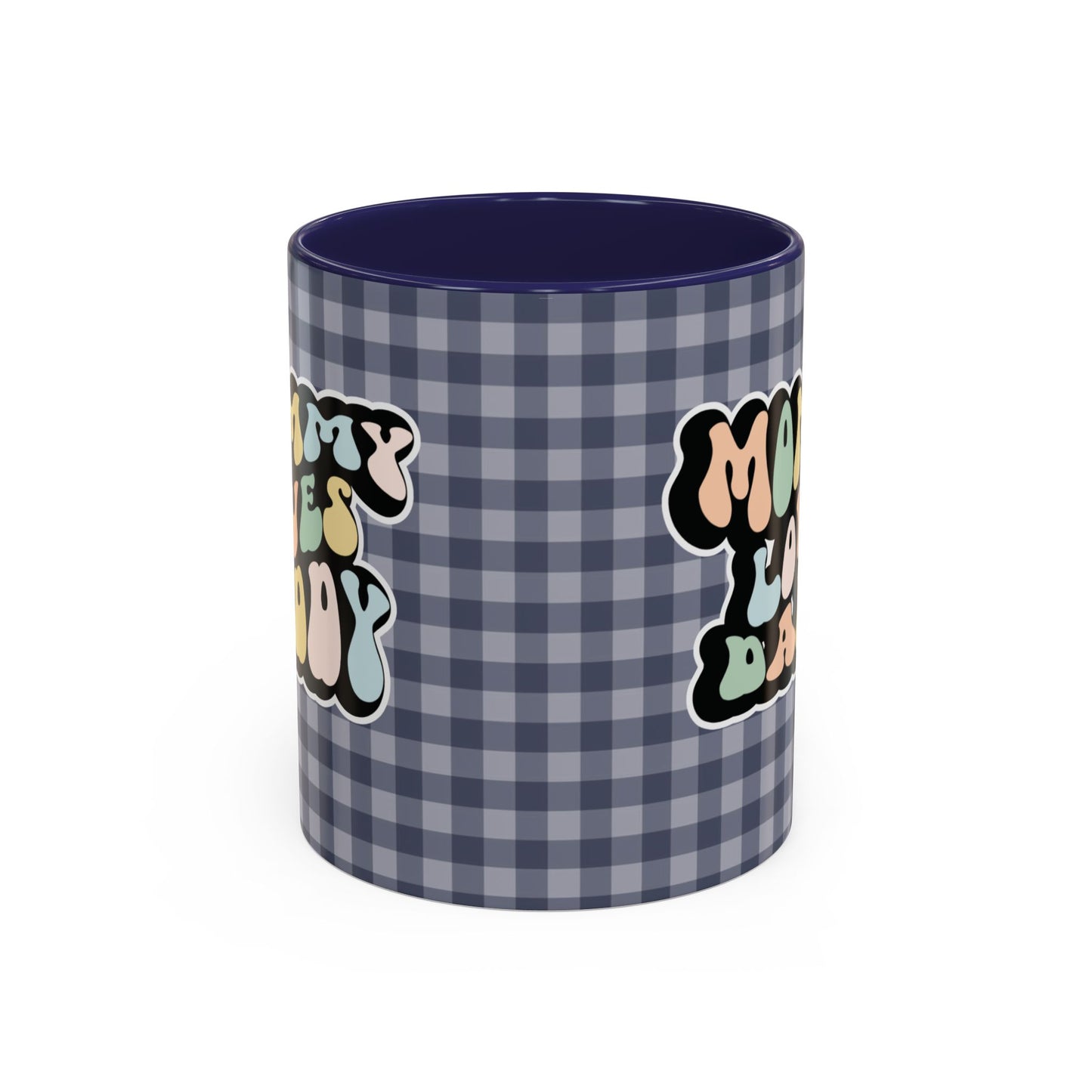 Perfect gift for mom. A decorative, 11oz ceramic mug. It’s wrapped in a navy blue-white checkered background. In a happy and colorful 70s retro-style font it says Mommy Loves Daddy, on both sides. 