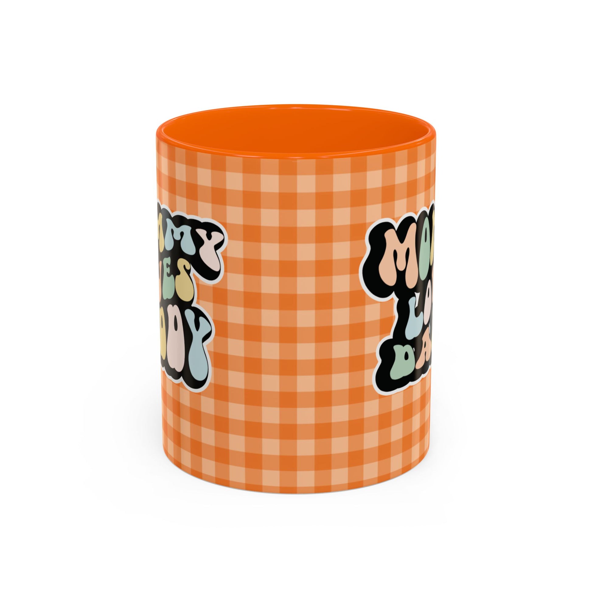 Perfect gift for mom. A decorative, 11oz ceramic mug. It’s wrapped in a orange-white checkered background. In a happy and colorful 70s retro-style font it says Mommy Loves Daddy, on both sides. 