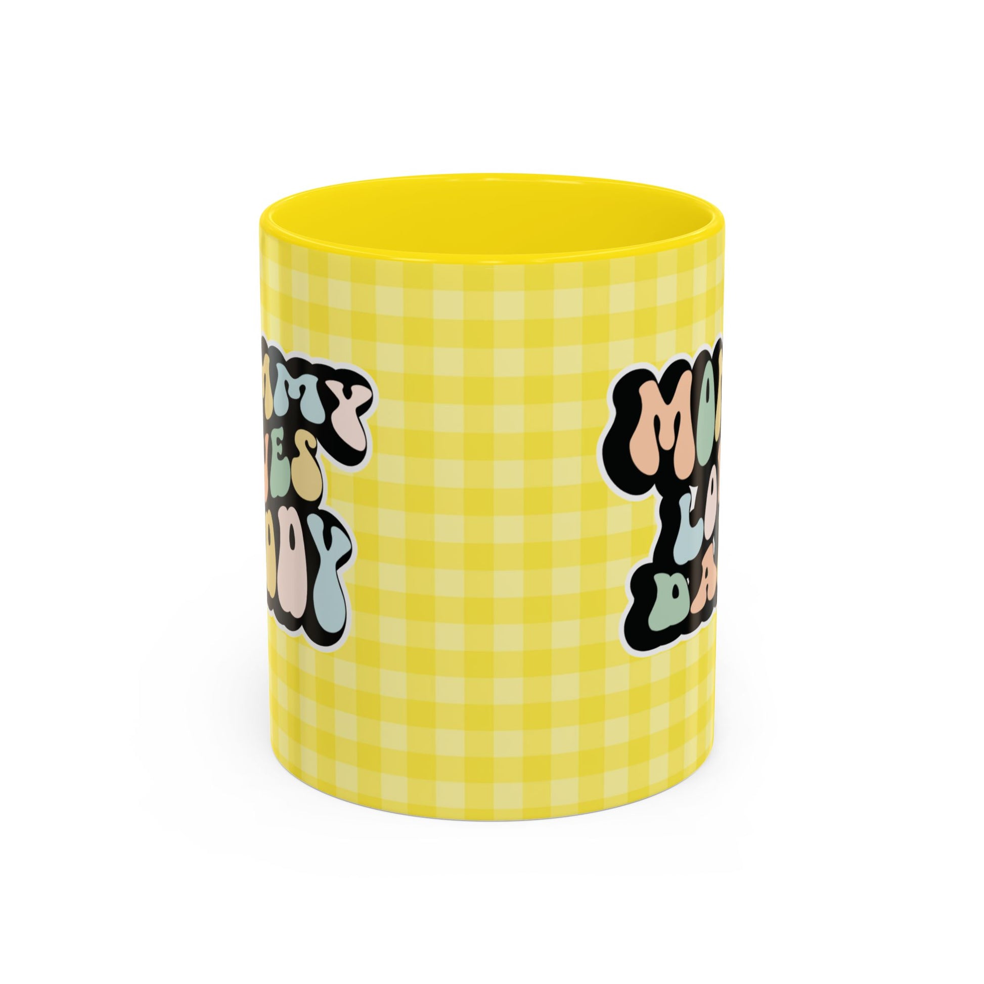 Perfect gift for mom. A decorative, 11oz ceramic mug. It’s wrapped in a yellow-white checkered background. In a happy and colorful 70s retro-style font it says Mommy Loves Daddy, on both sides. 
