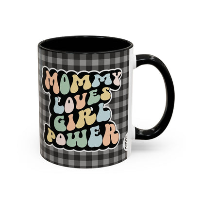 Perfect gift for mom. A decorative, 11oz ceramic mug. It’s wrapped in a black-white checkered background. In a happy and colorful 70s retro-style font it says Mommy Loves Girl Power, on both sides. 